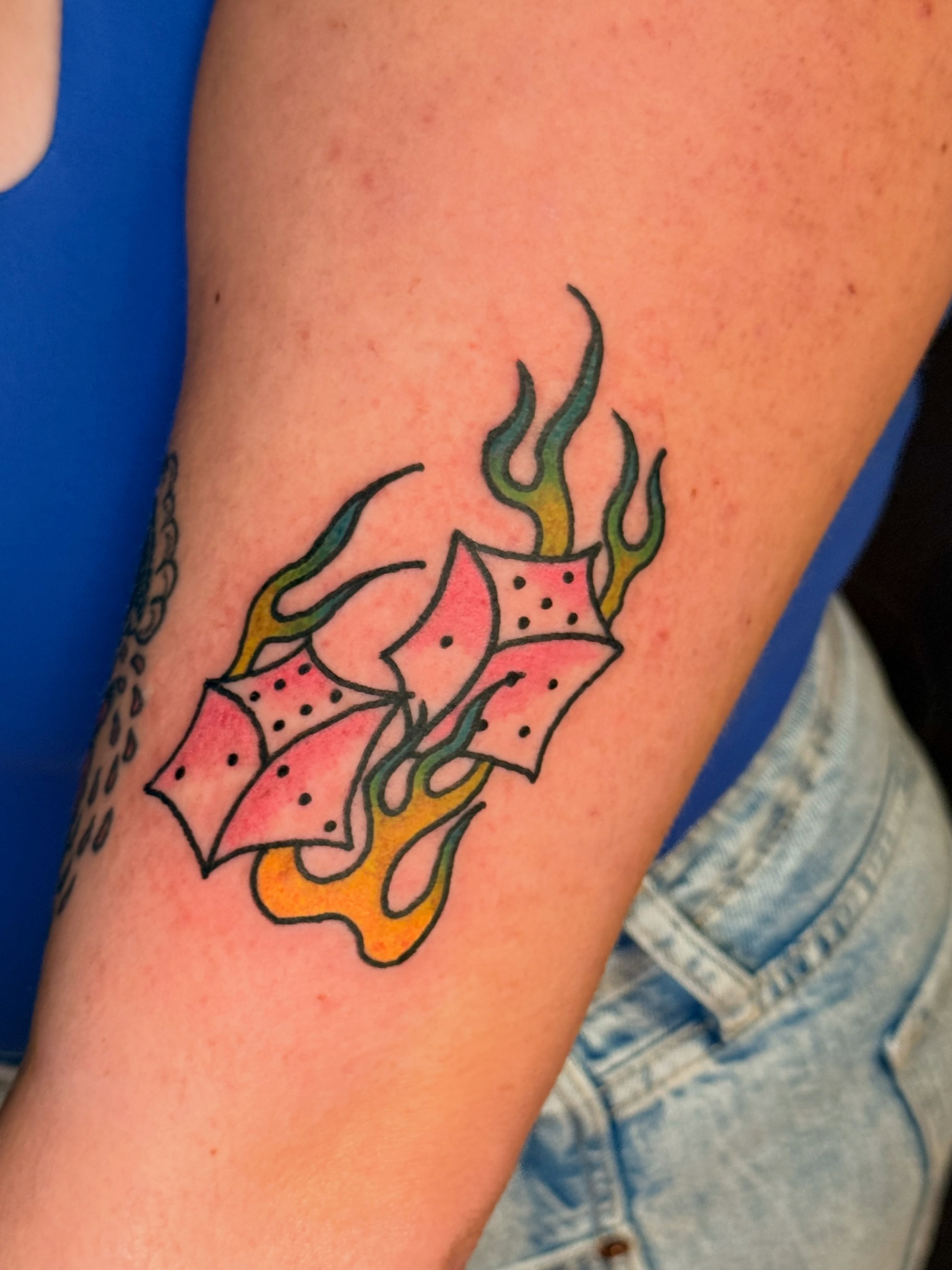 Dice with flames American traditional tattoo on the forearm by Ty Hamilton