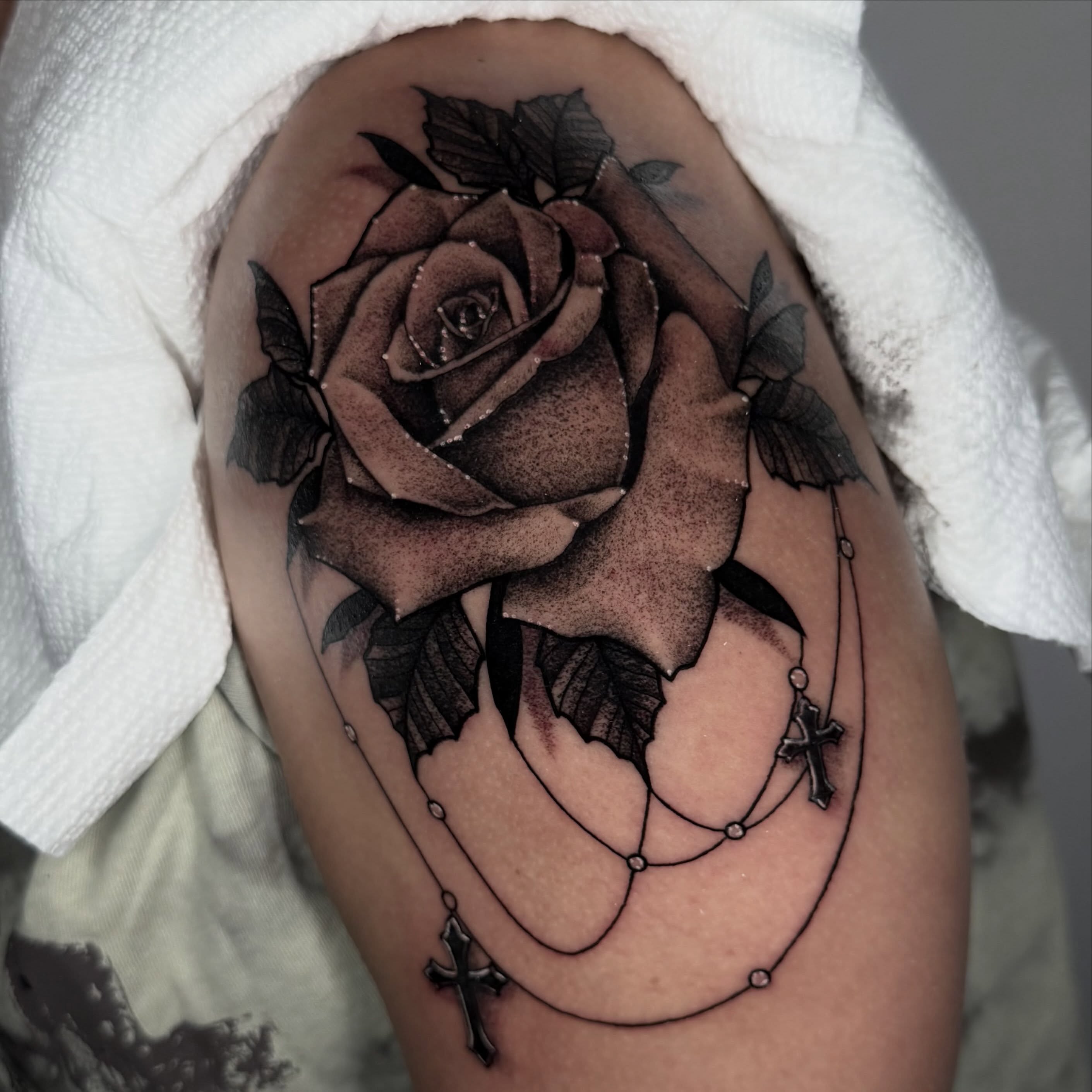 Rose and rosary realism tattoo on the thigh by πΈπππππππ πΈππππππππ, Bel Air, Maryland