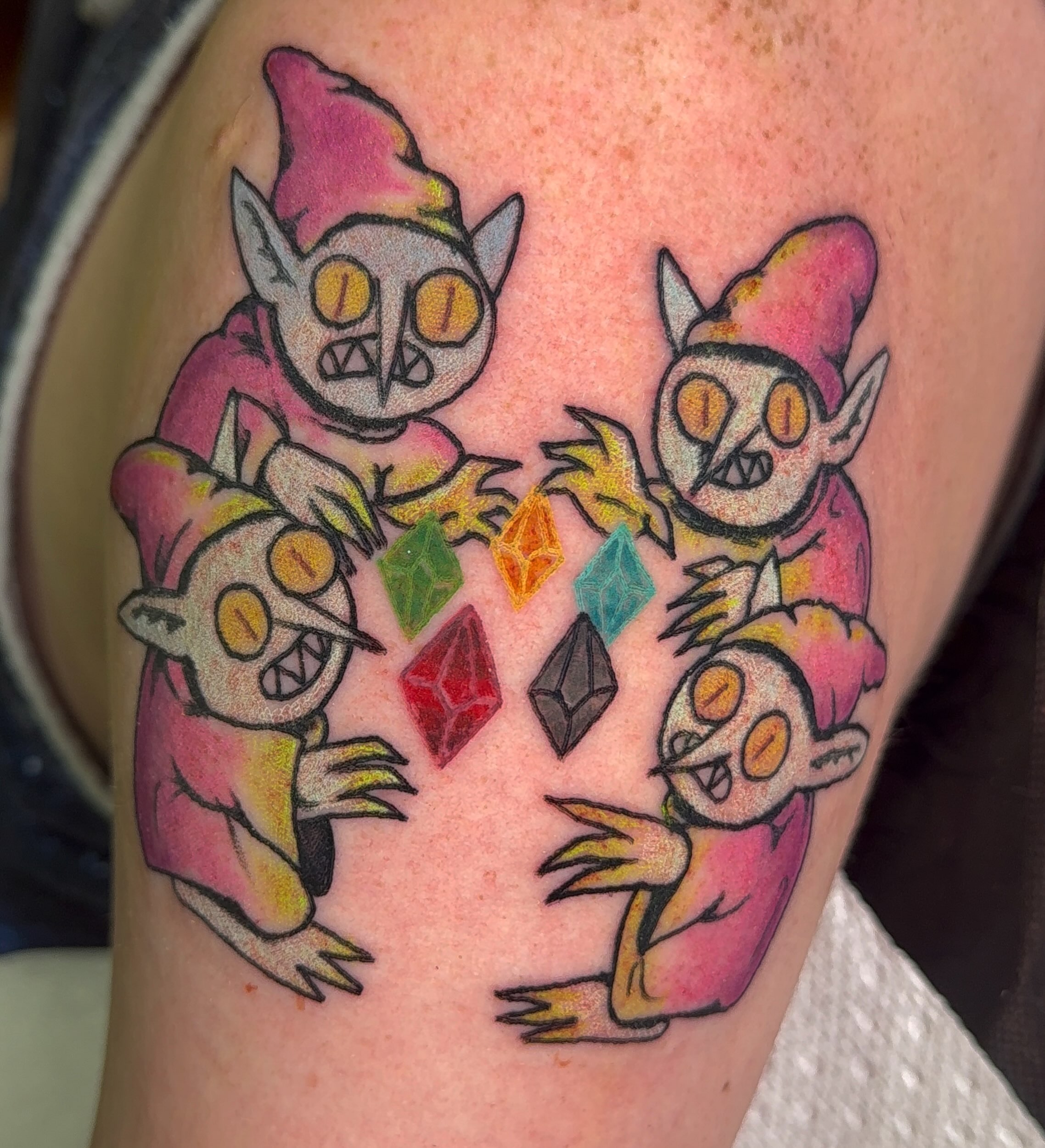 Demon skulls American traditional tattoo on the thigh by Erin McDavis