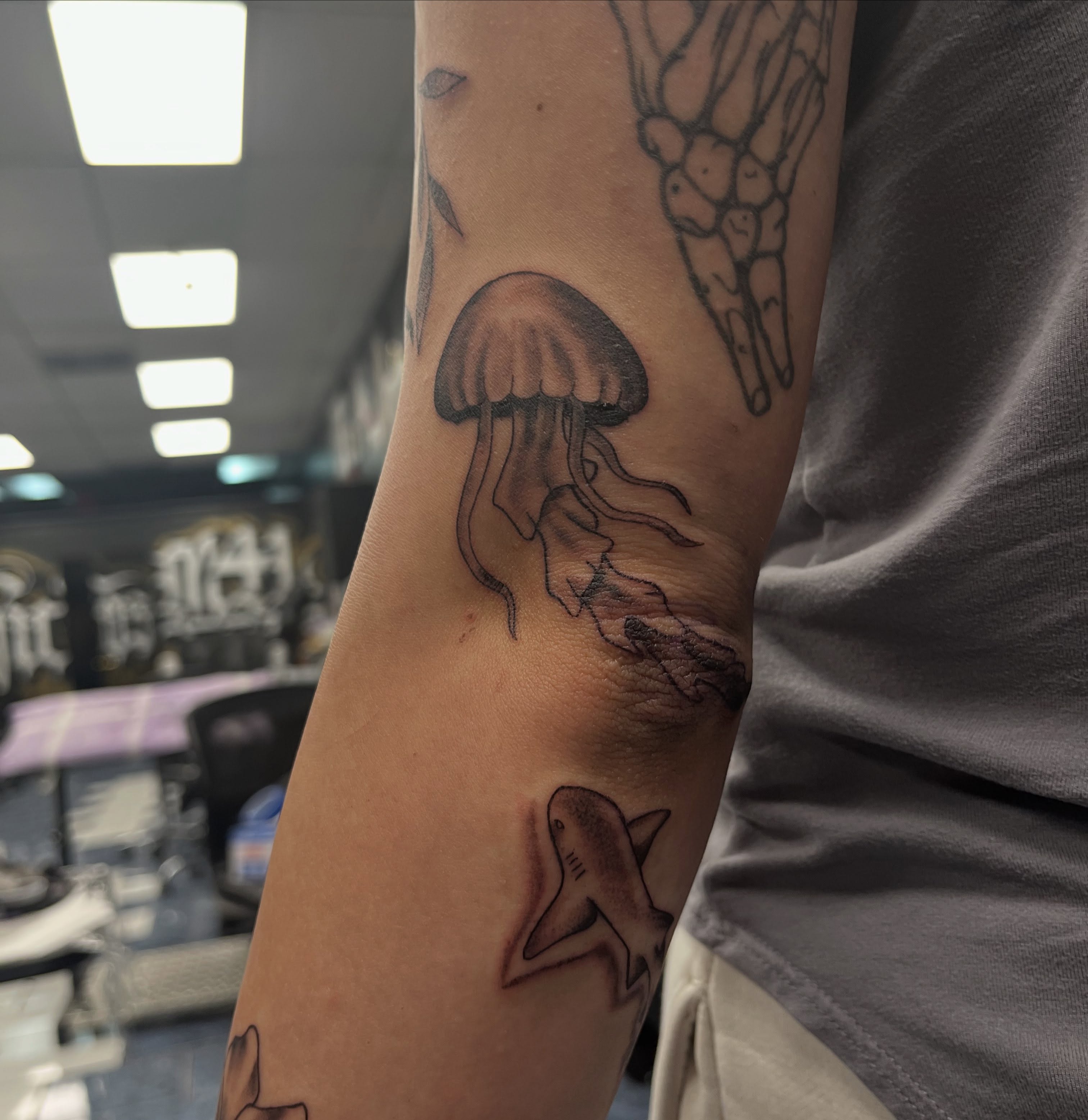Jellyfish shark black and grey tattoo on the forearm by @artinjections667