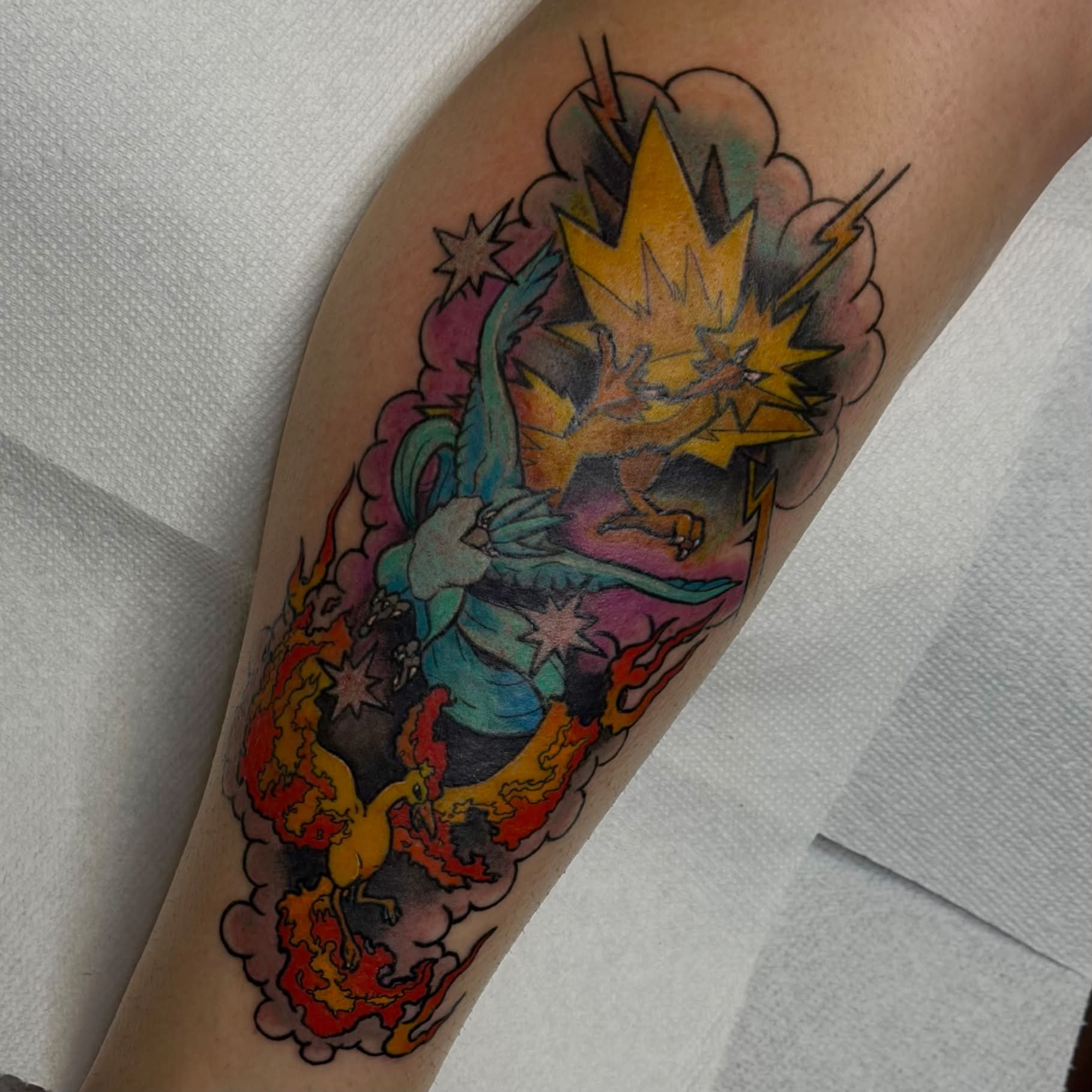 Dragon and phoenix American traditional tattoo on the forearm by Kenneth Prince