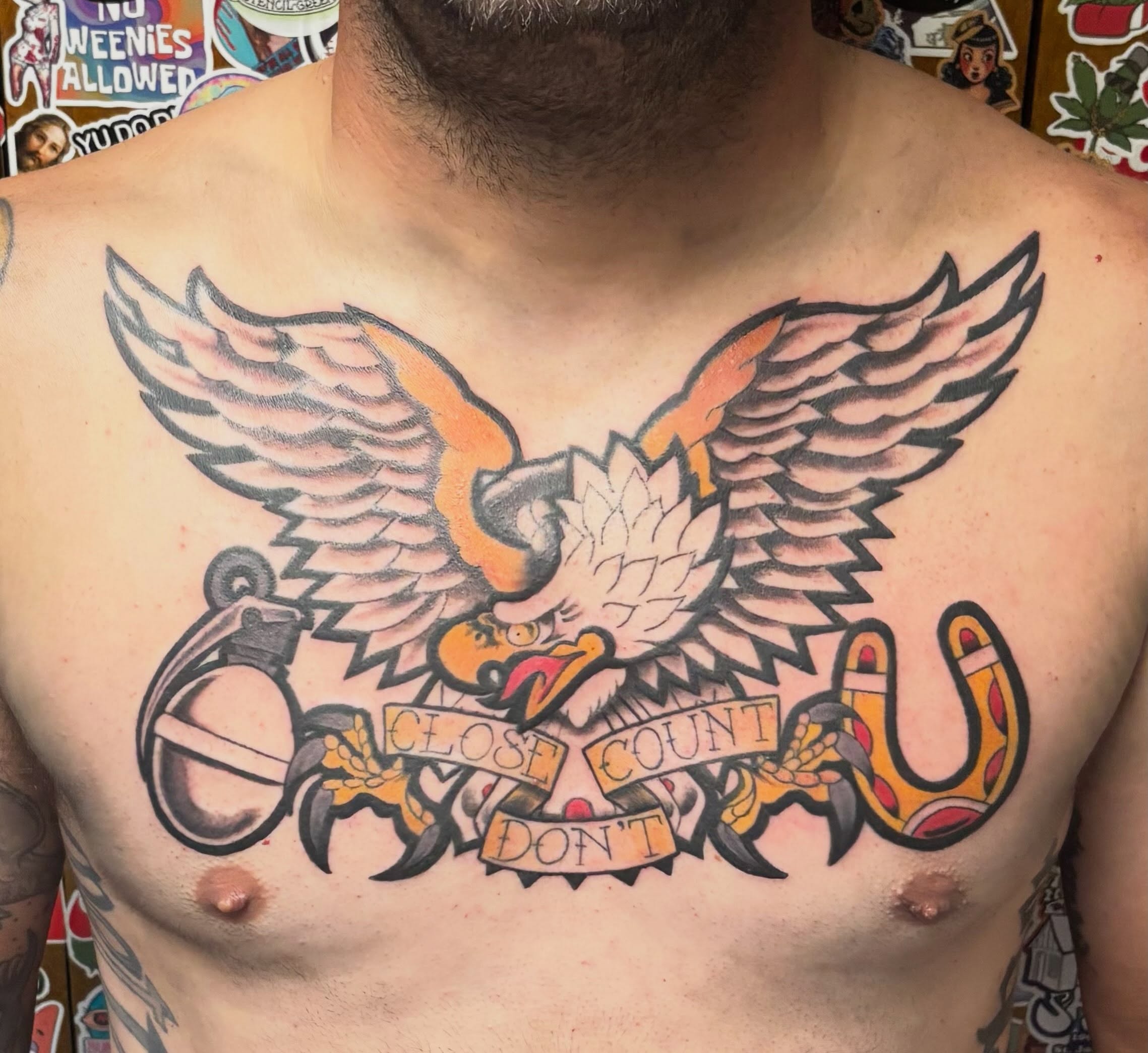 Eagle with banner American traditional tattoo on the chest by Jeff Zuptich