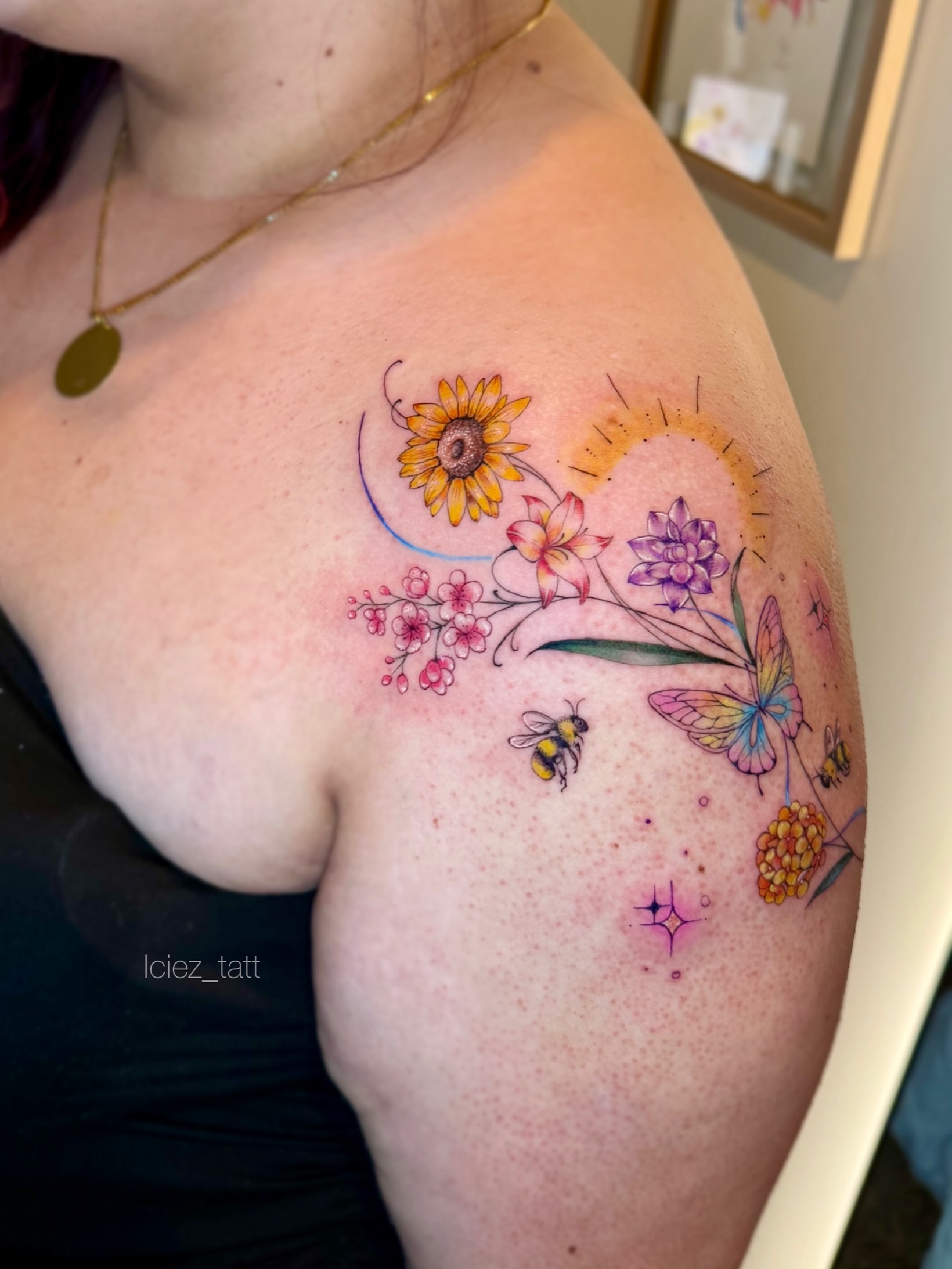 Floral bouquet watercolor tattoo on the shoulder by Iciez