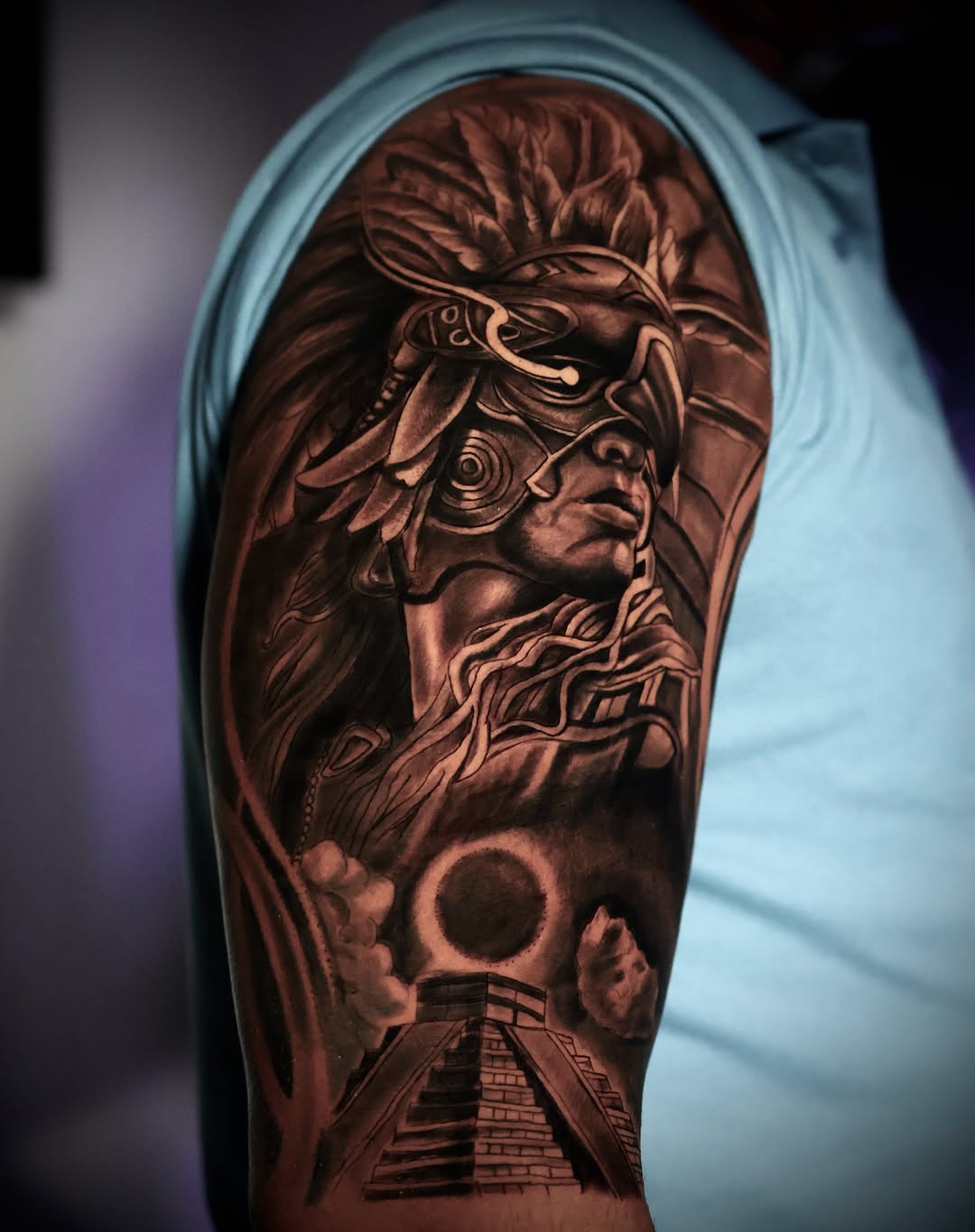 Indian warrior realism tattoo on the upper arm by German Patiño.