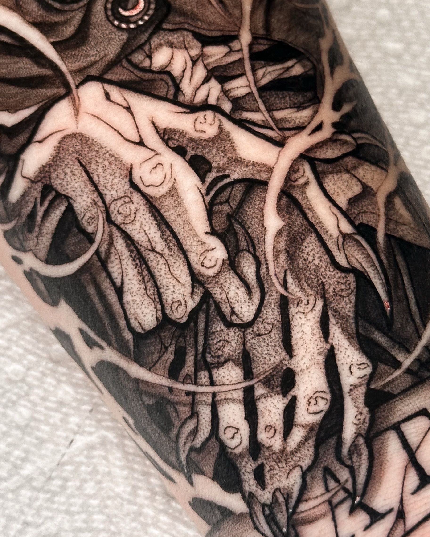 Hands entwined realism tattoo on the forearm by Taylin Johnson- Illustrative Blackwork, Columbus, Ohio
