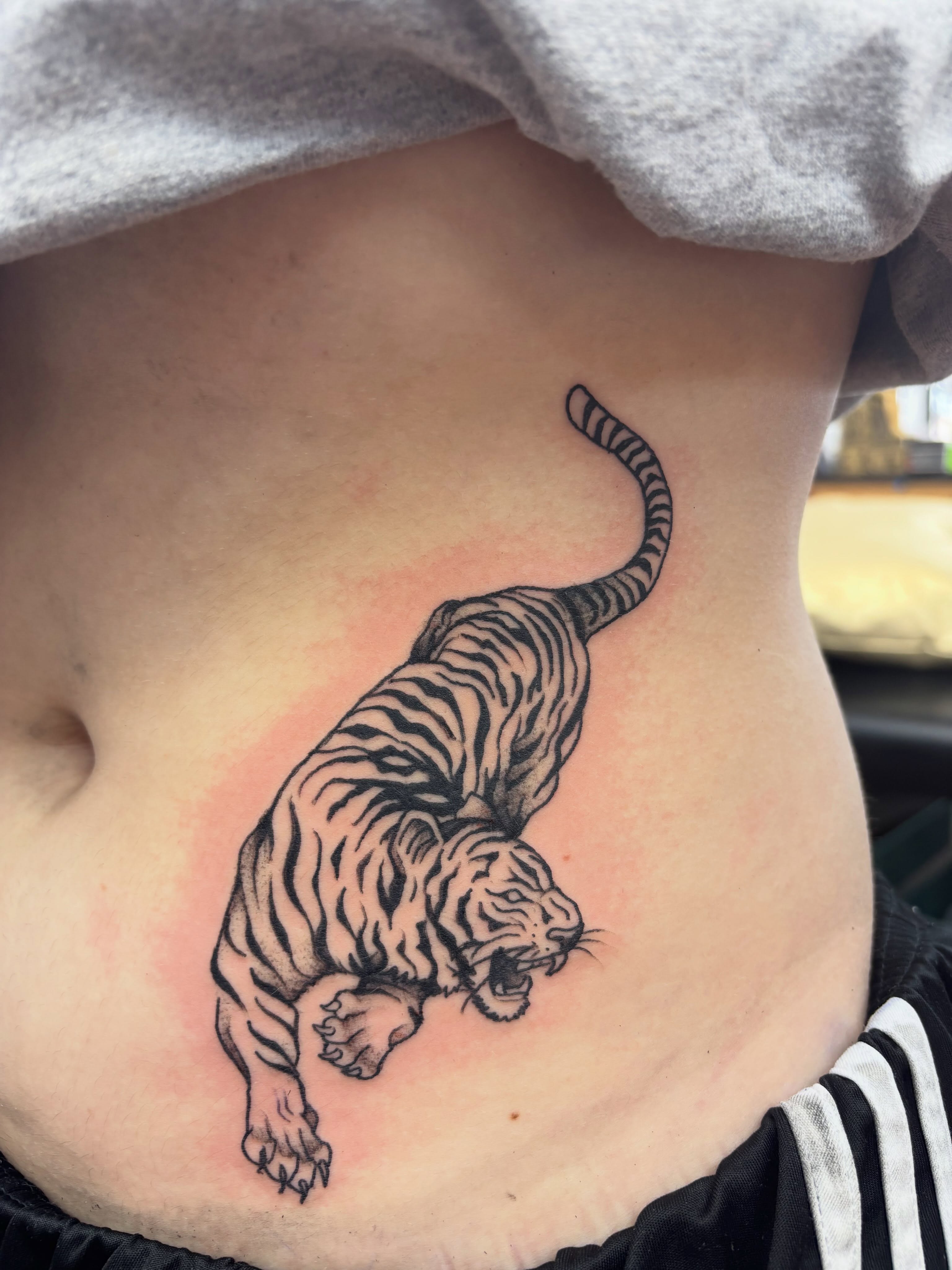 Tiger black and grey tattoo on the ribs by Sam Hearnen, Lawrence, Kansas