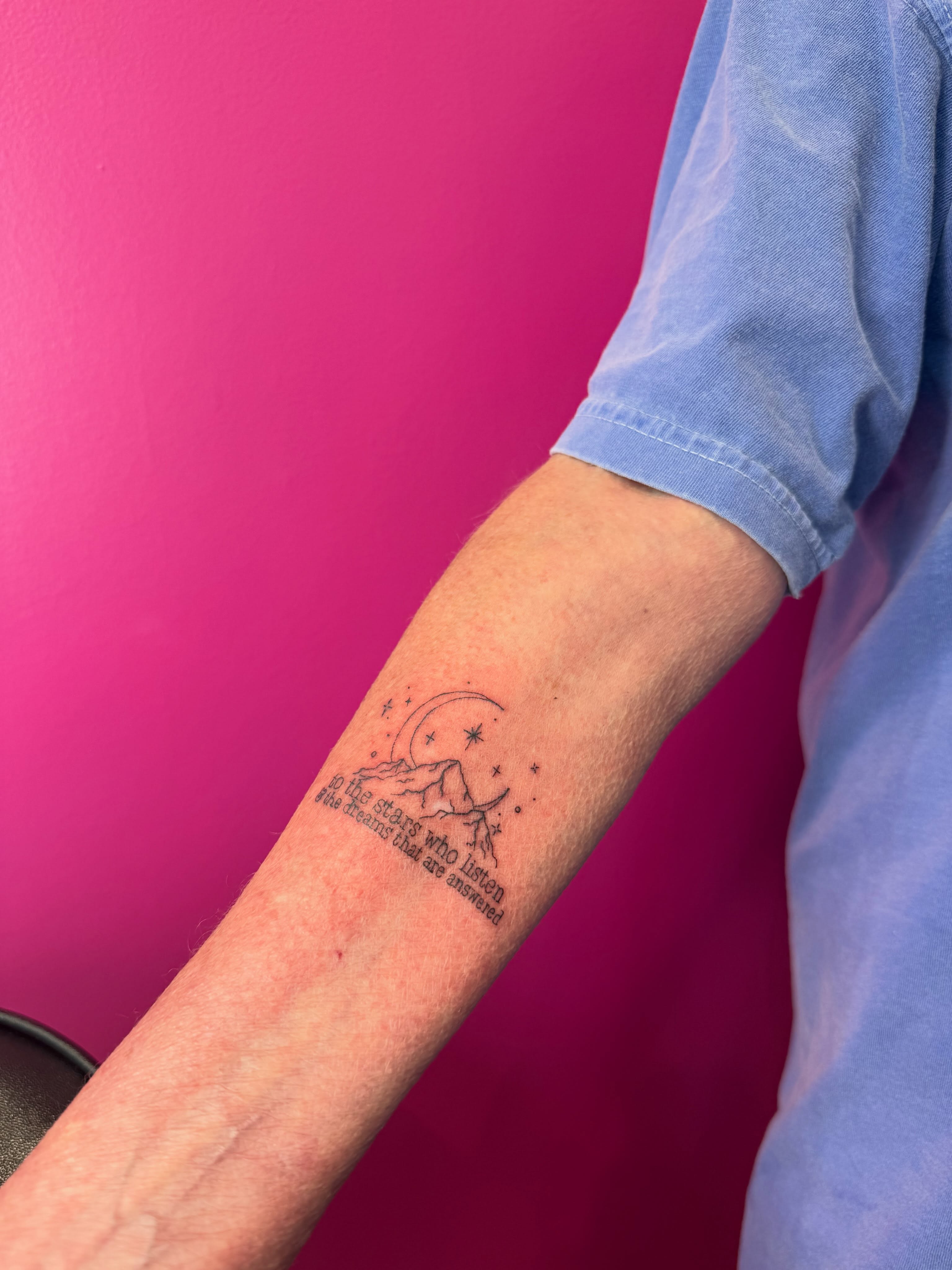 Mountain and crescent moon fine line tattoo on the forearm by fine line tattoos