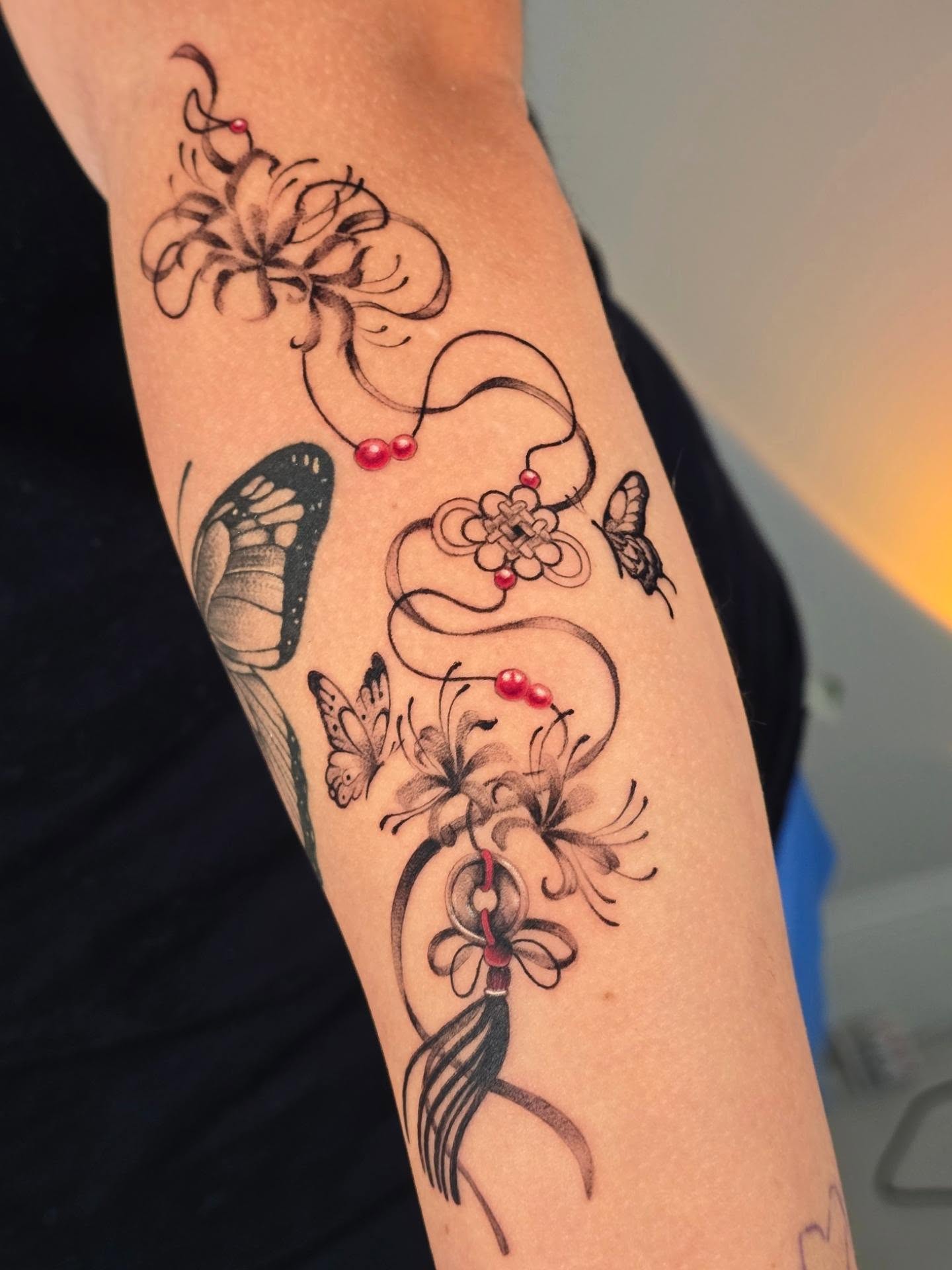 Floral arrangement ornamental tattoo on the forearm by Scribbles (Teala René), Charlotte, North Carolina