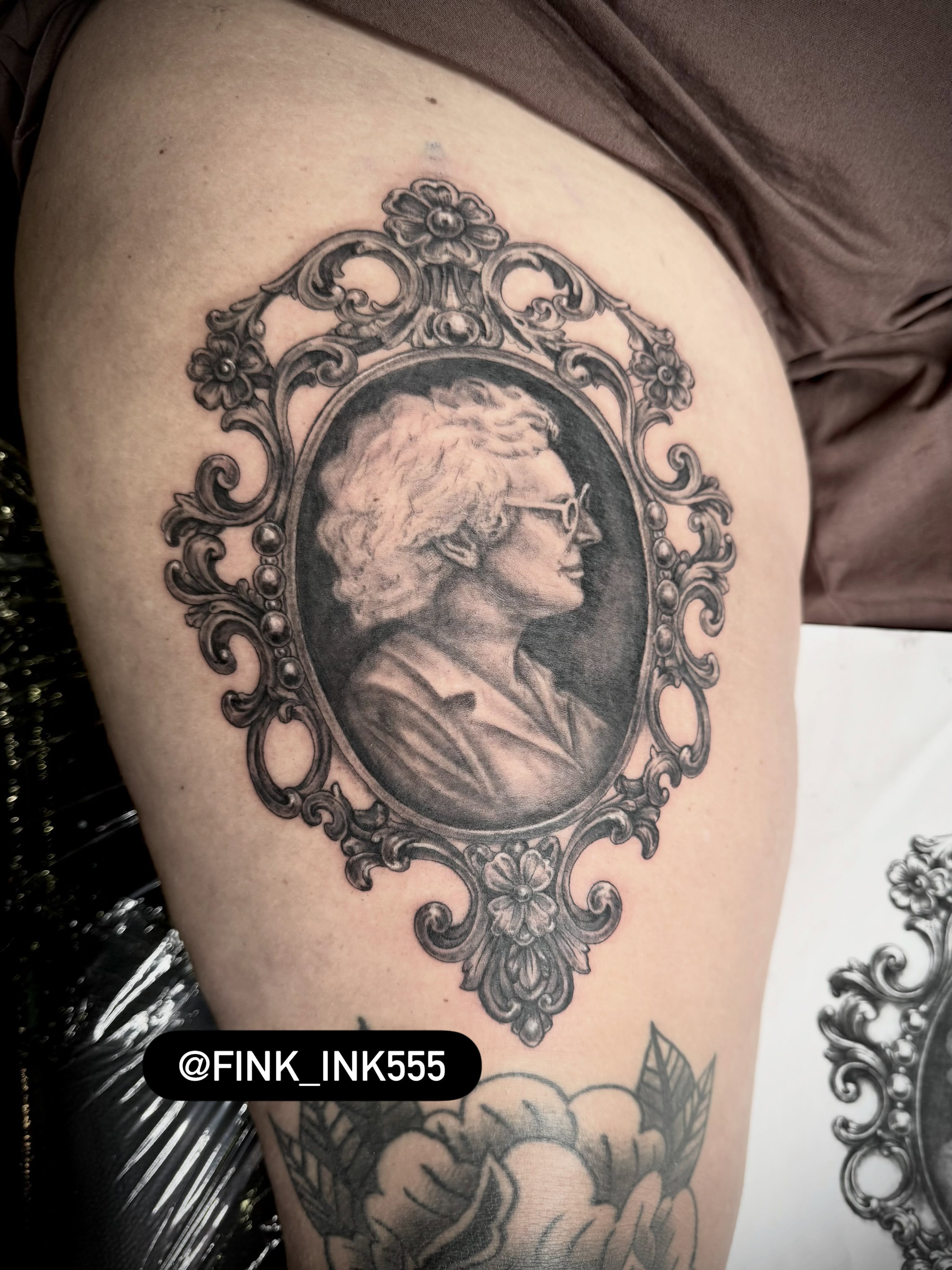 Tattoo by @fink_ink555 — black_and_grey, realism