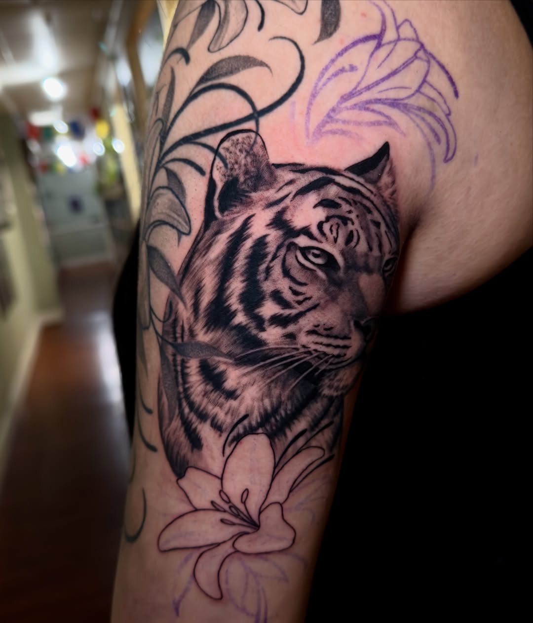 Tiger realism tattoo on the forearm by Marisa Biddle