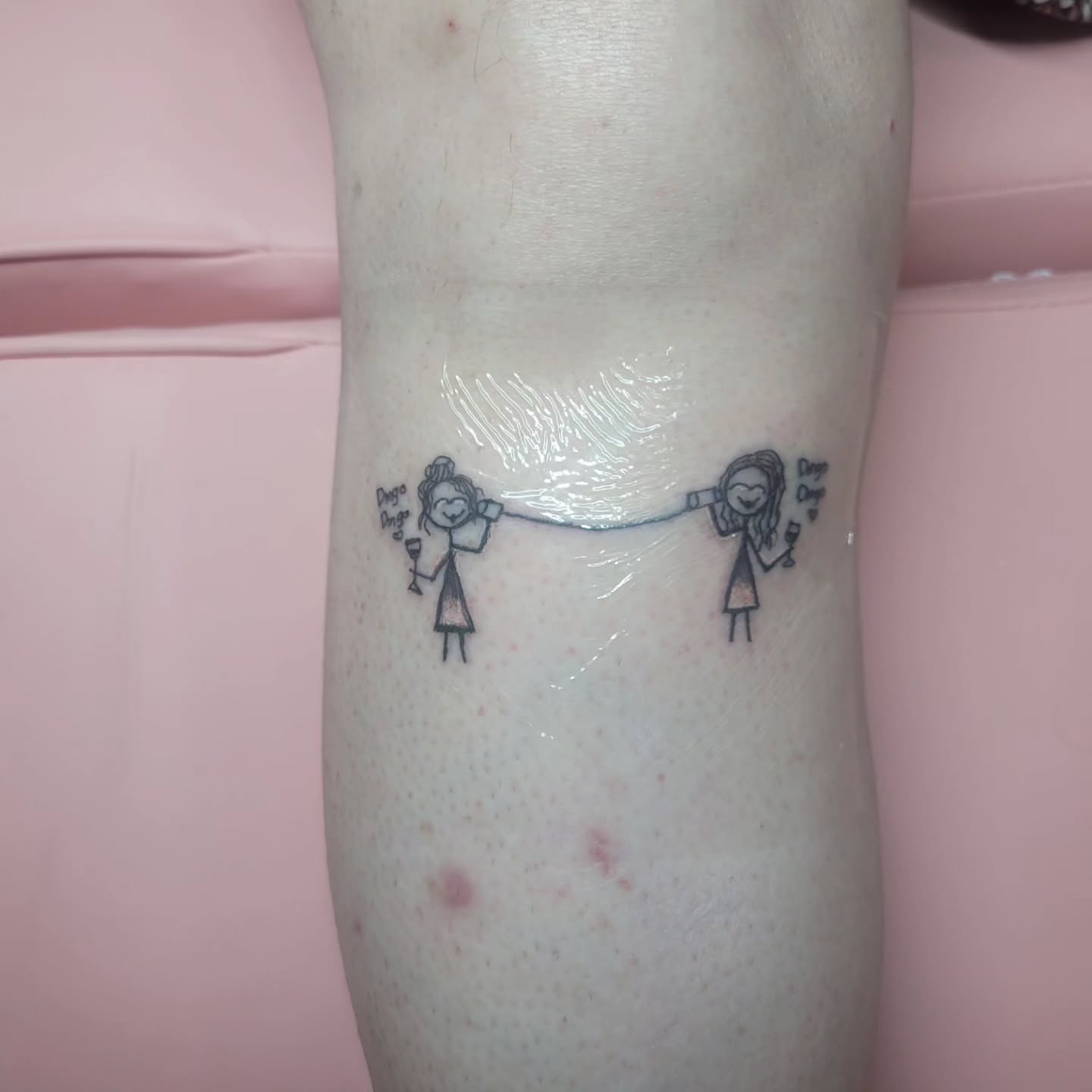 Stick figures black and grey tattoo on the forearm by Peach & Poke, Lethbridge, Alberta