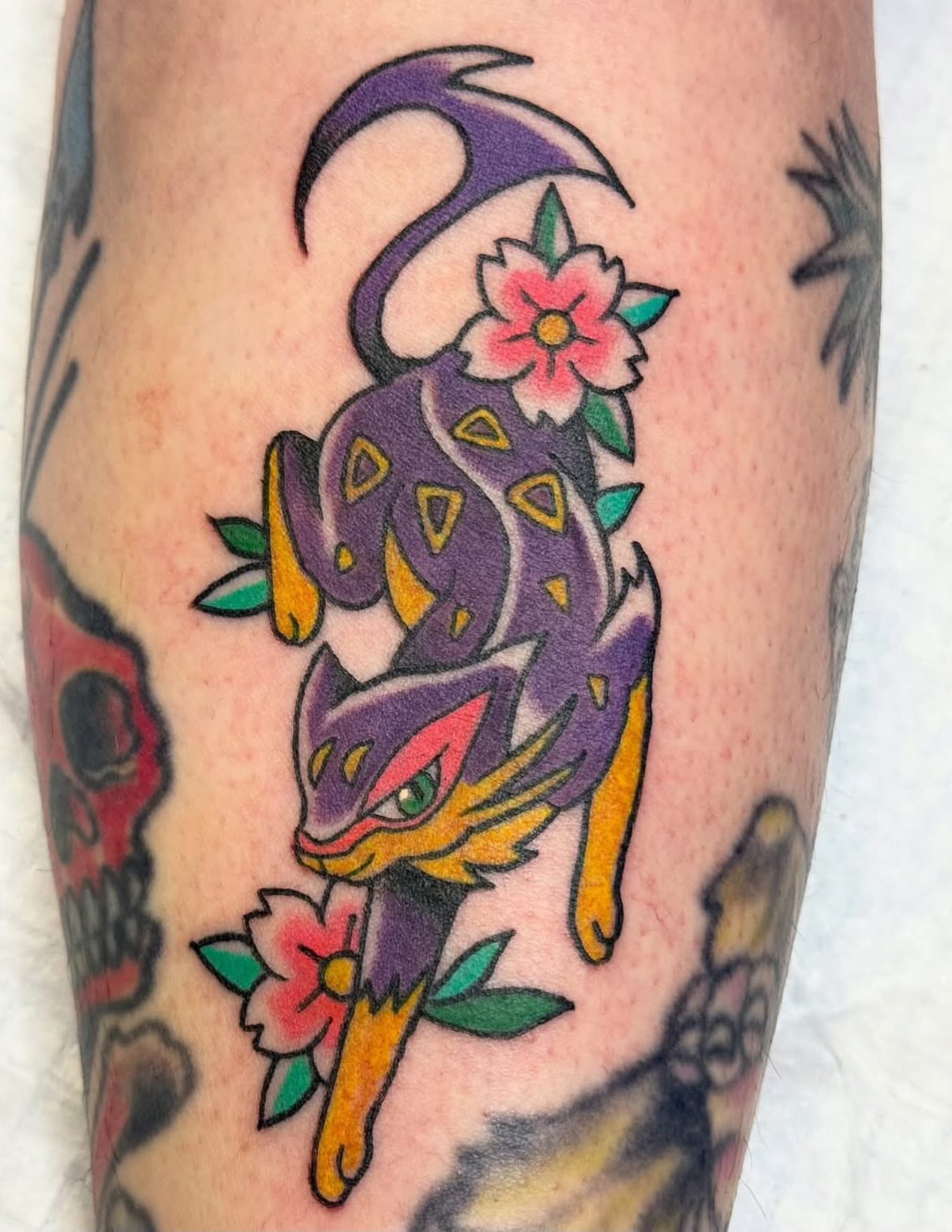 Chibi dragon American traditional tattoo on the forearm by Kelsey Turnis