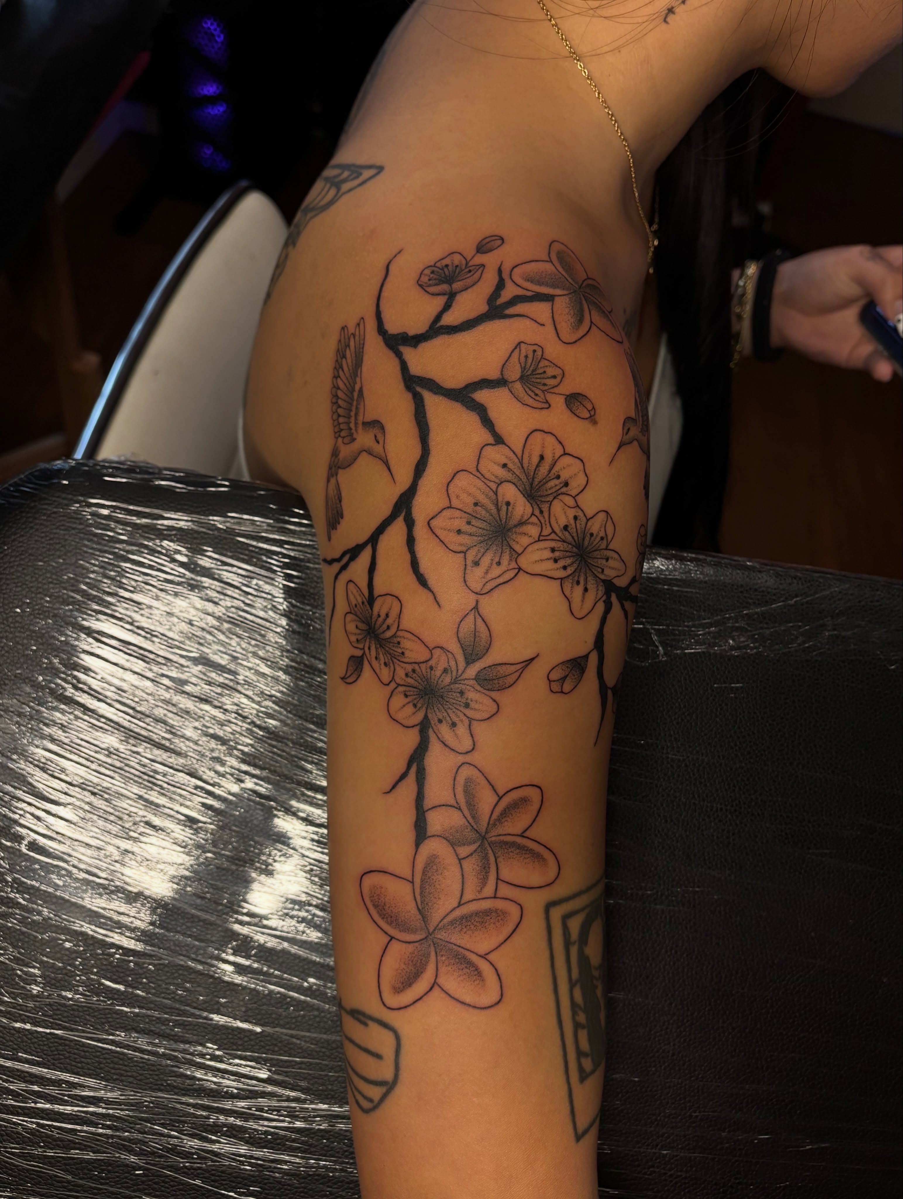 Cherry blossoms and bird black and grey tattoo on the forearm by the ink witch ๐ฎ๐ค๐