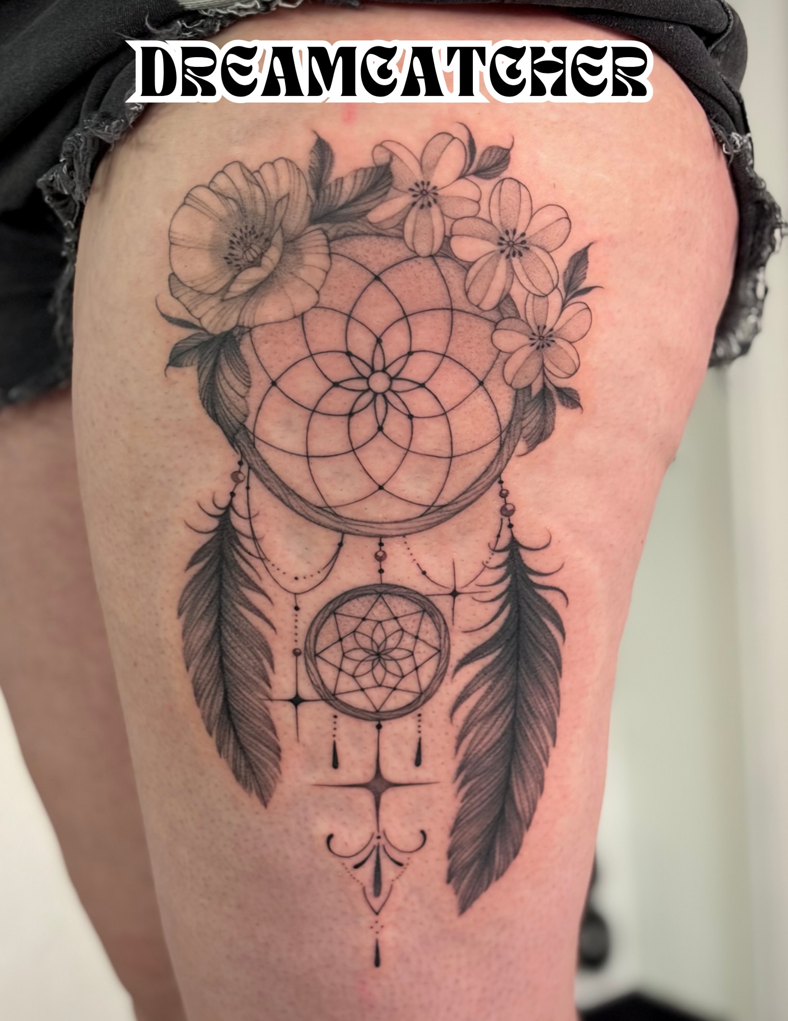 Dreamcatcher black and grey tattoo on the thigh by Victoria Lamorte