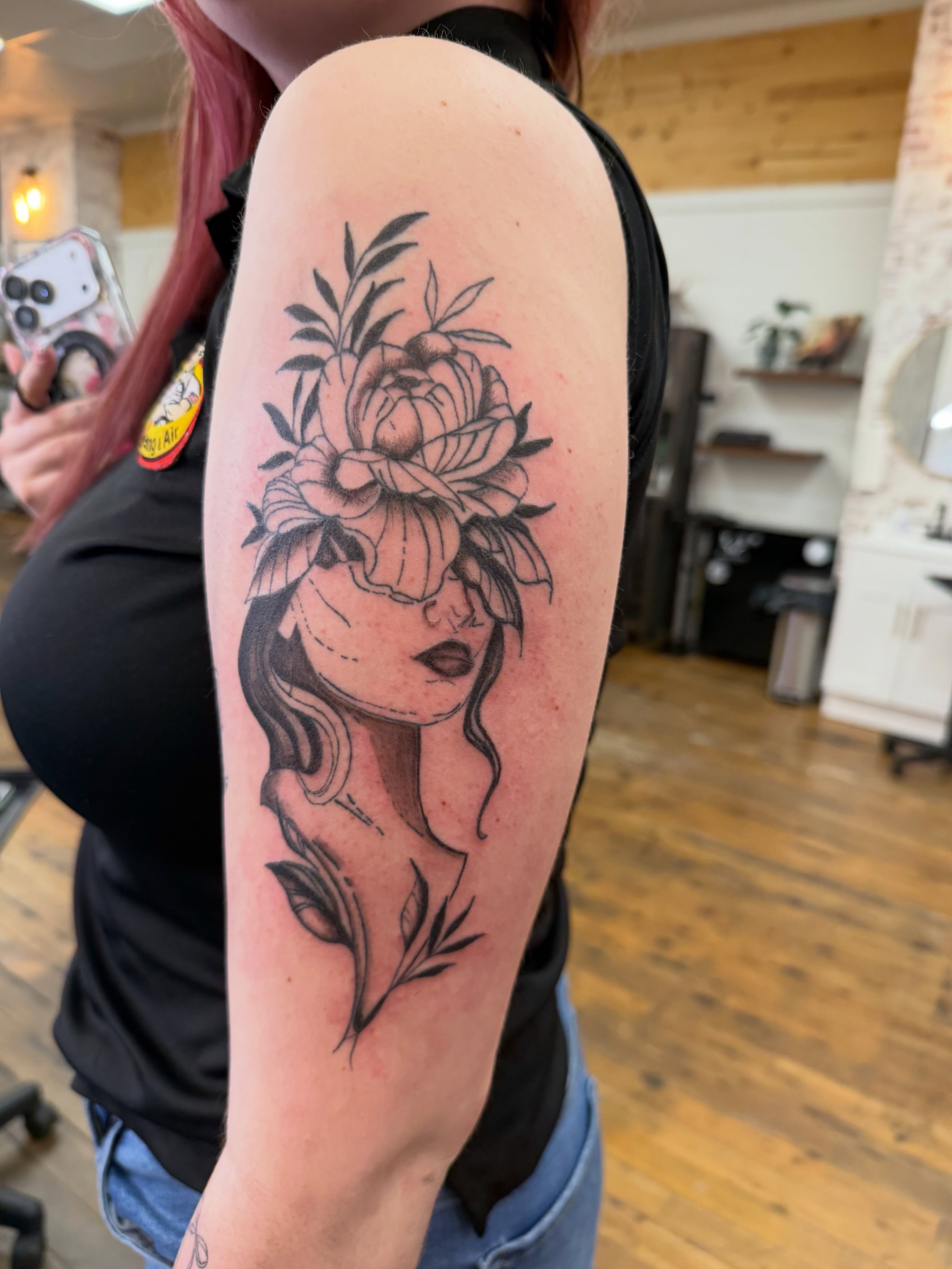 Floral woman realism tattoo on the forearm by Whimsy Ink