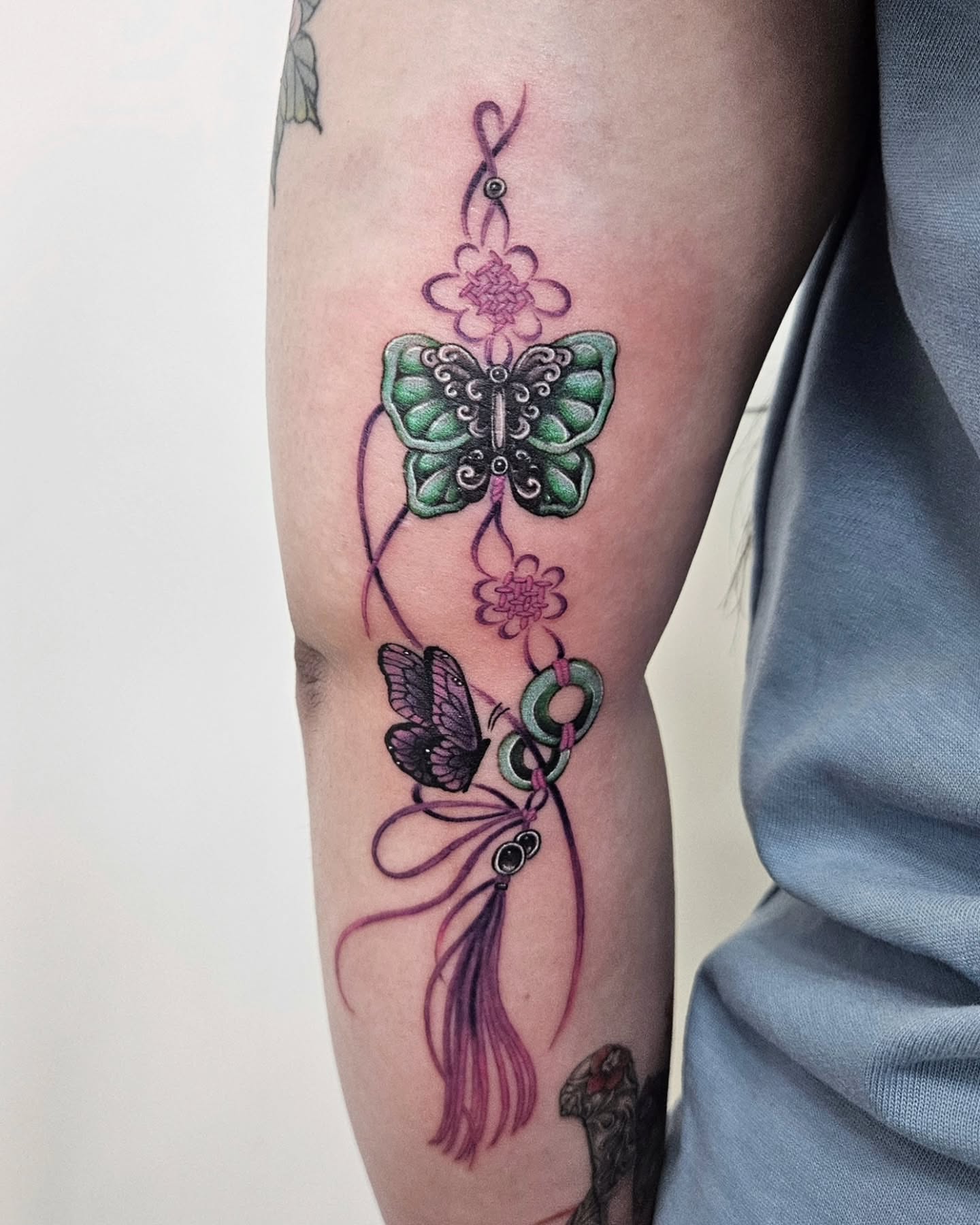 Butterfly and flowers geometric tattoo on the forearm by Tattooer Hermin 허민