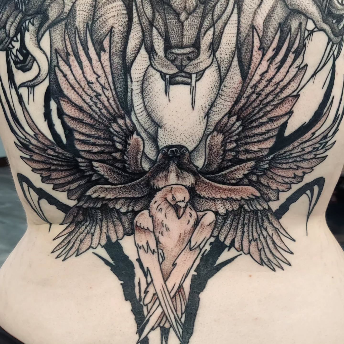 Lion and bird dotwork tattoo on the torso by Kari Rhoades, Marion, Iowa