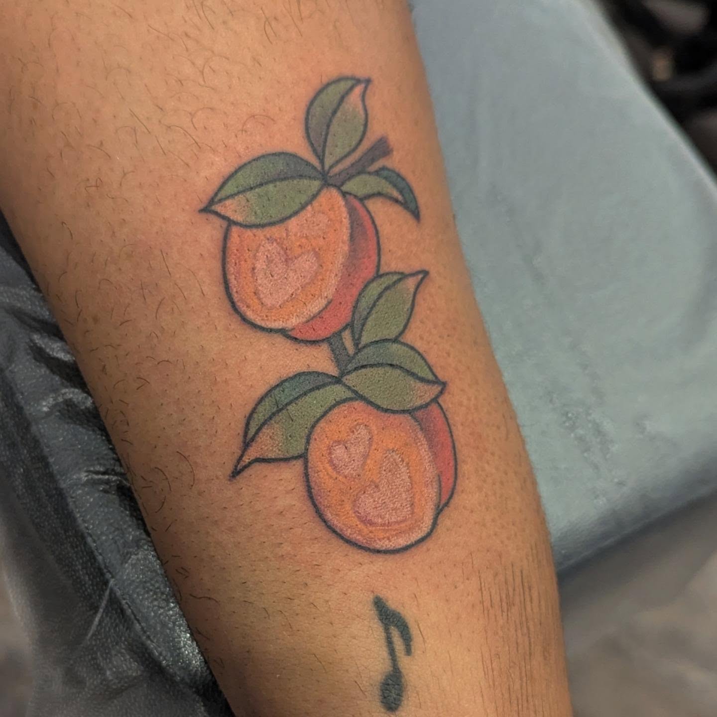 Peaches American traditional tattoo on the forearm by Spencer Jennings, Westland, Michigan