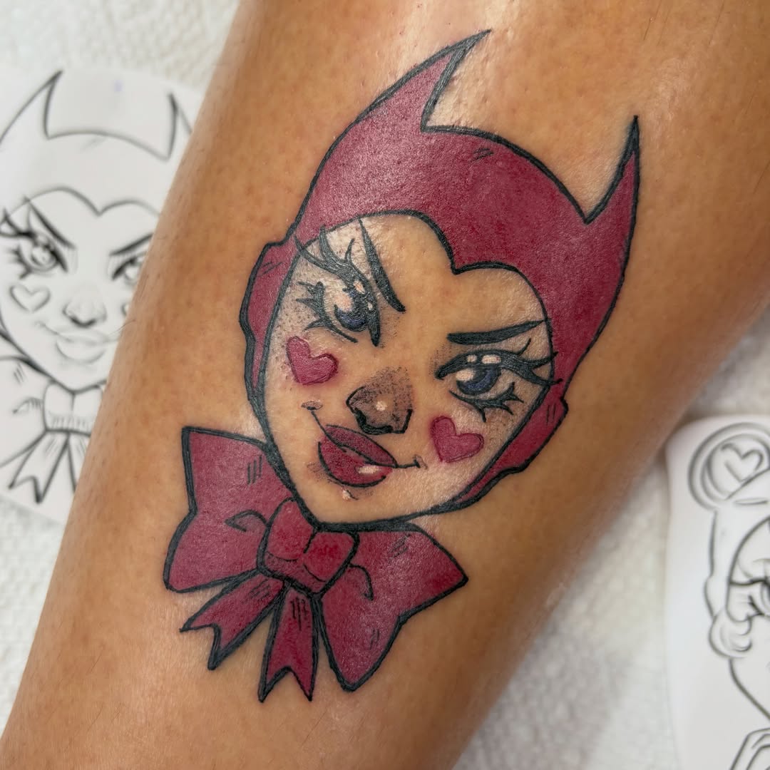 Red hooded character American traditional tattoo on the forearm by Gabby