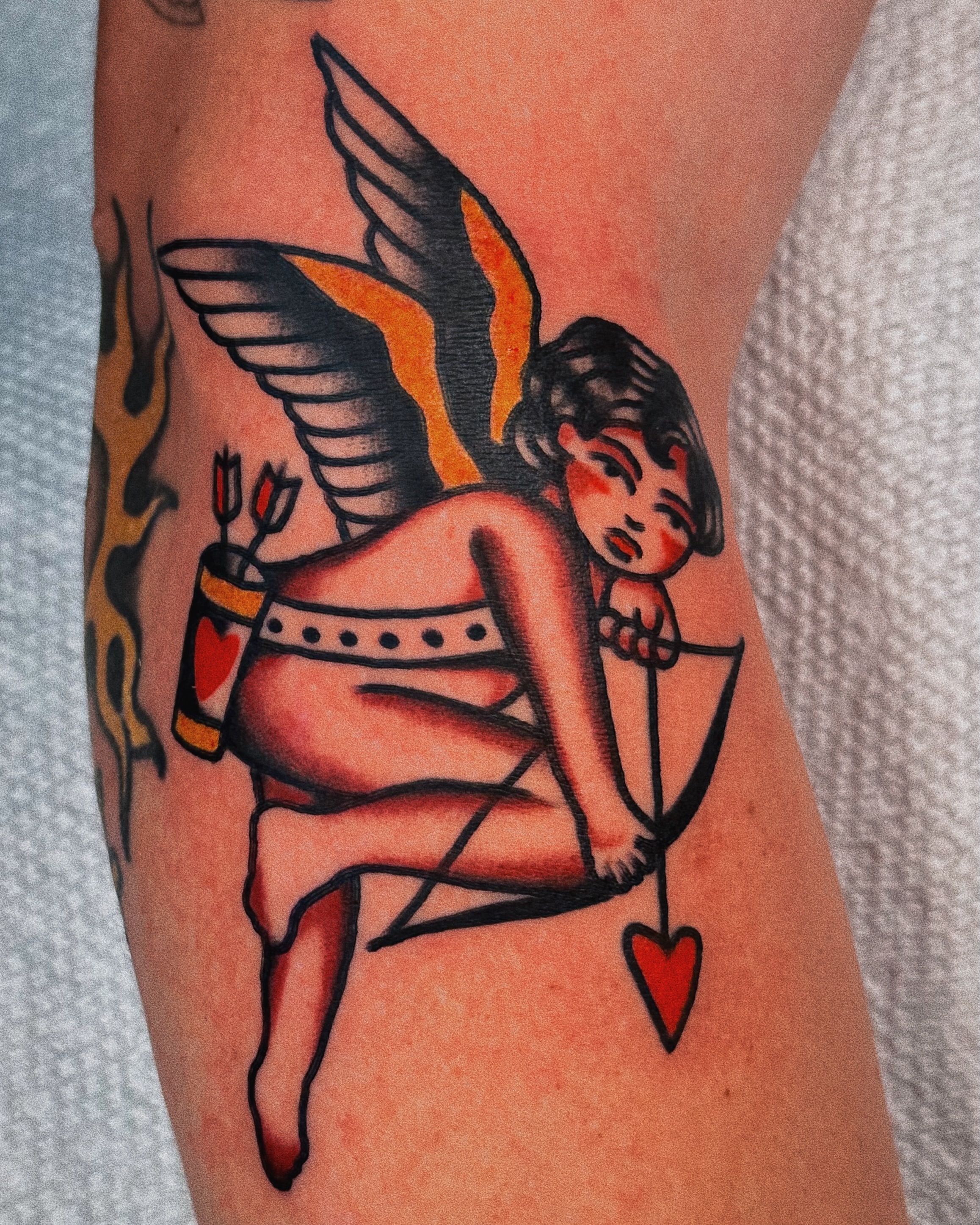 Cupid American traditional tattoo on the forearm by Sean Michel, Nashua, New Hampshire