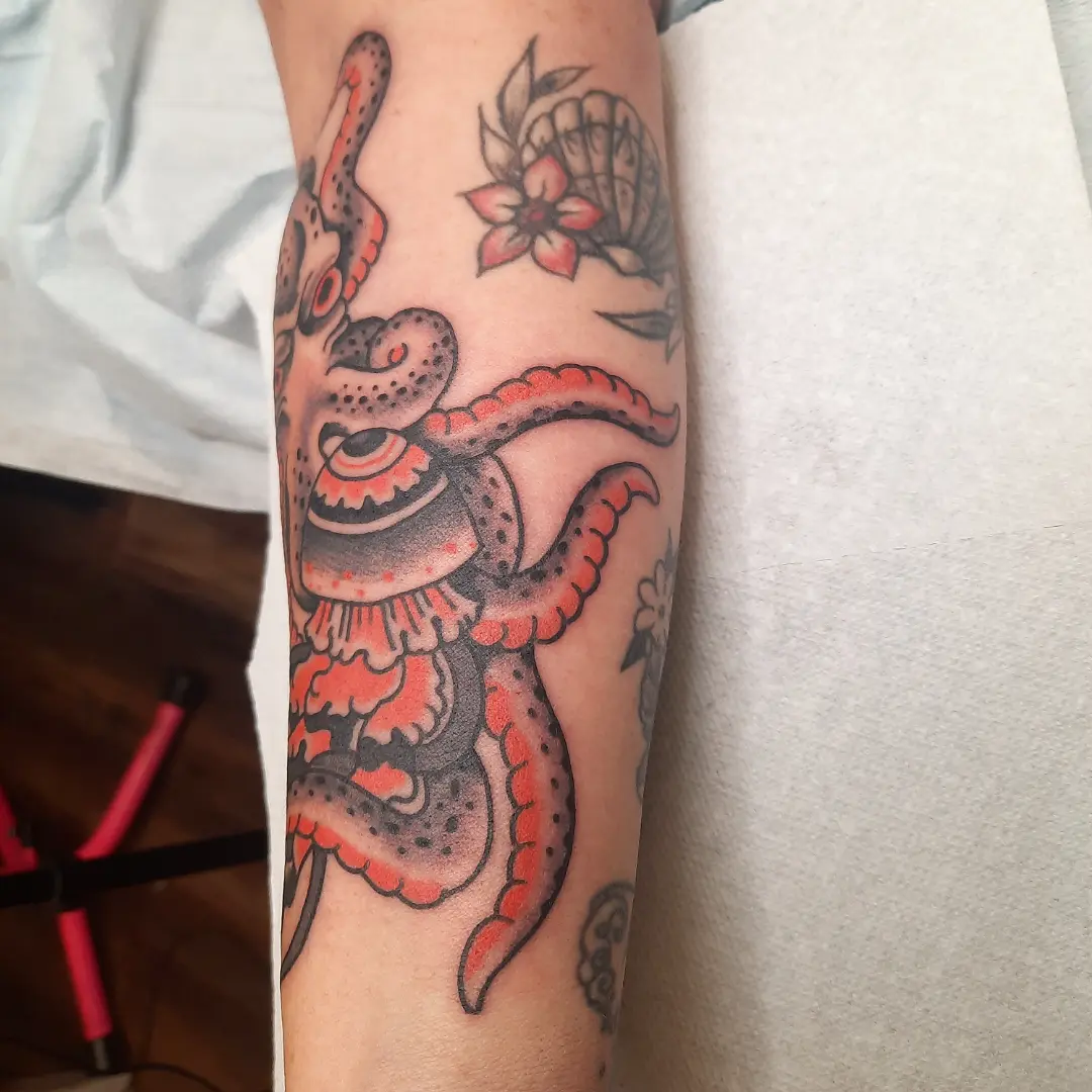Octopus American traditional tattoo on the forearm by Kaetlyn