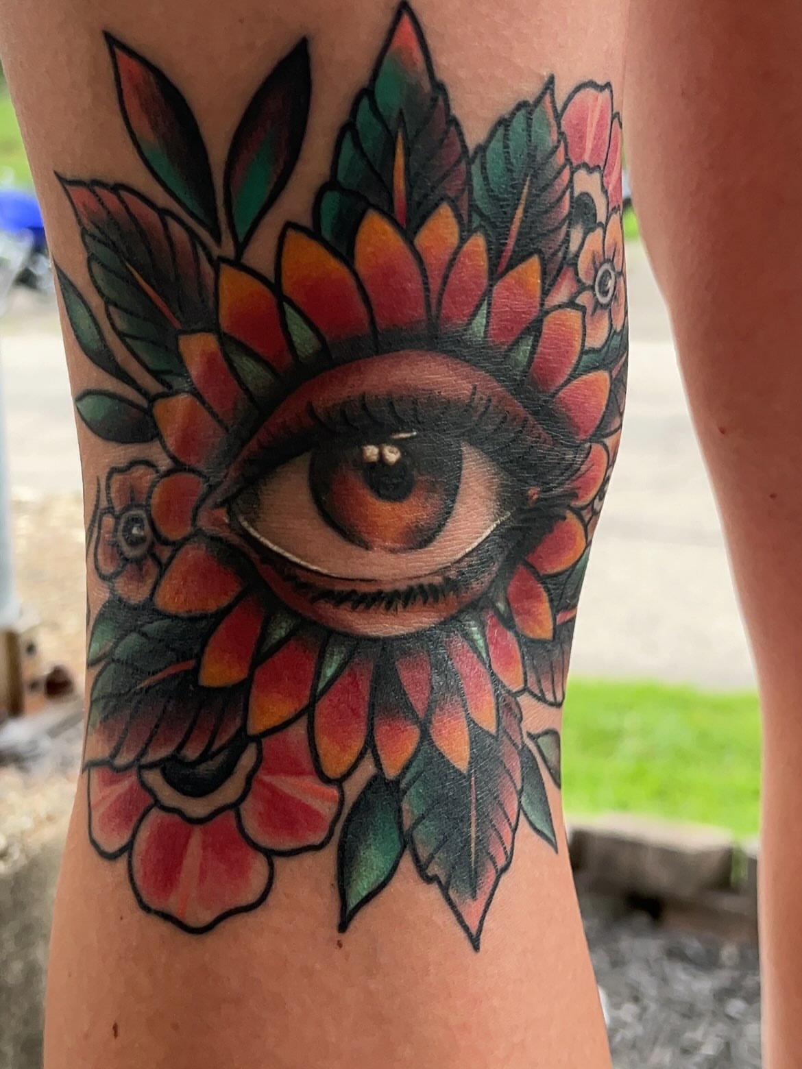 Eye with floral crown American traditional tattoo on the forearm by Dylan O'Quin