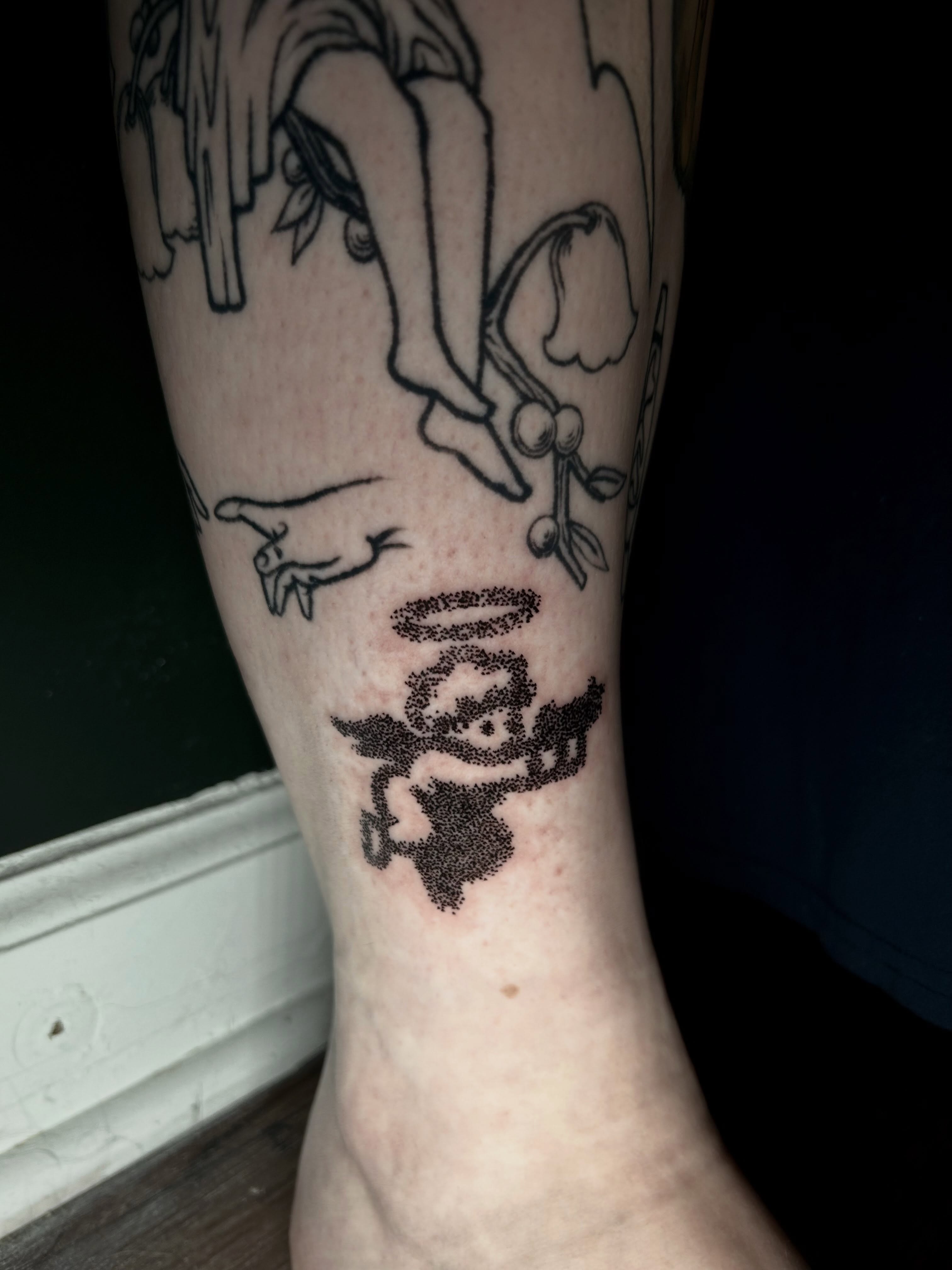 Angel dotwork tattoo on the calf by KB