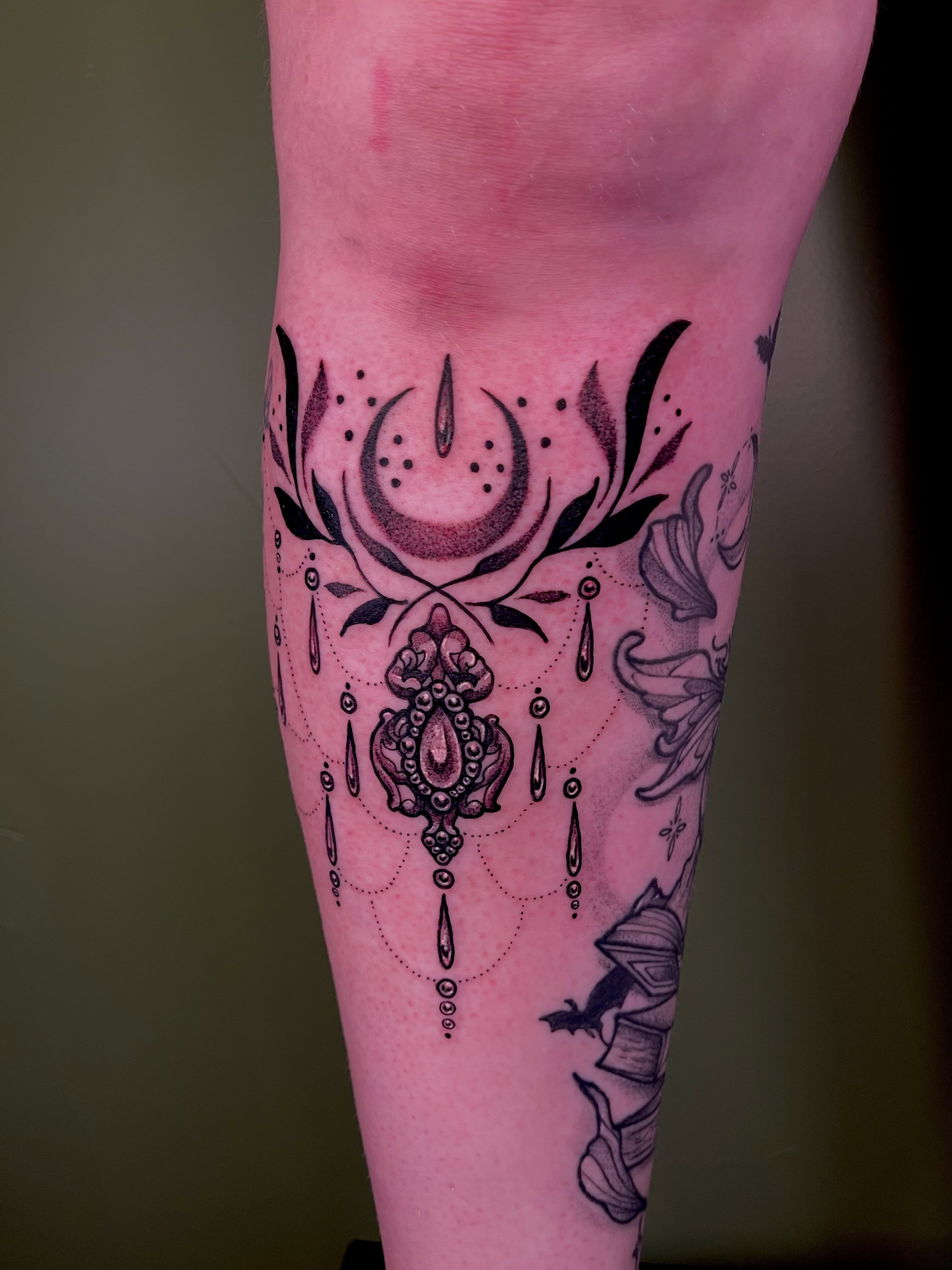 Ornamental design dotwork tattoo on the forearm by Destiny Tolman