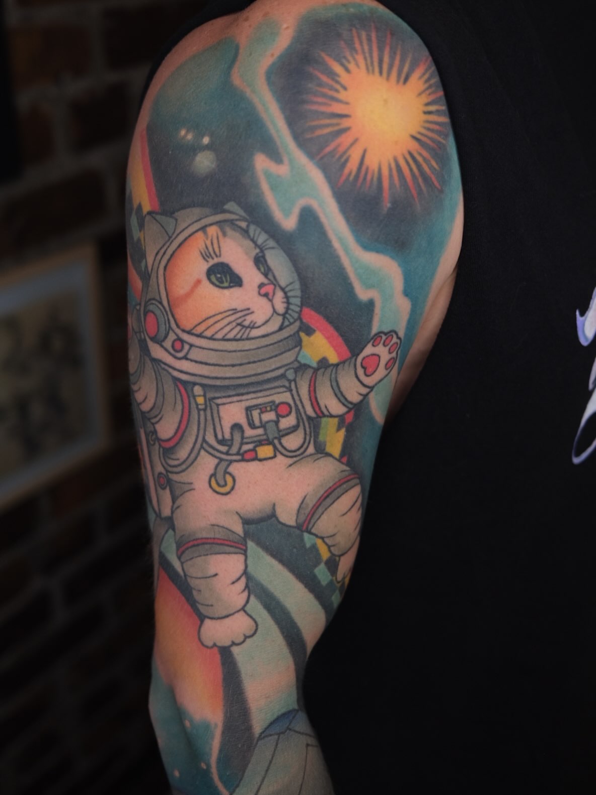 Astronaut cat new school tattoo on the forearm by James Maxwell