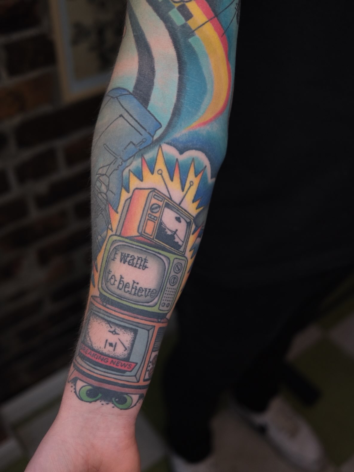 Tv and alien abduction American traditional tattoo on the forearm by James Maxwell