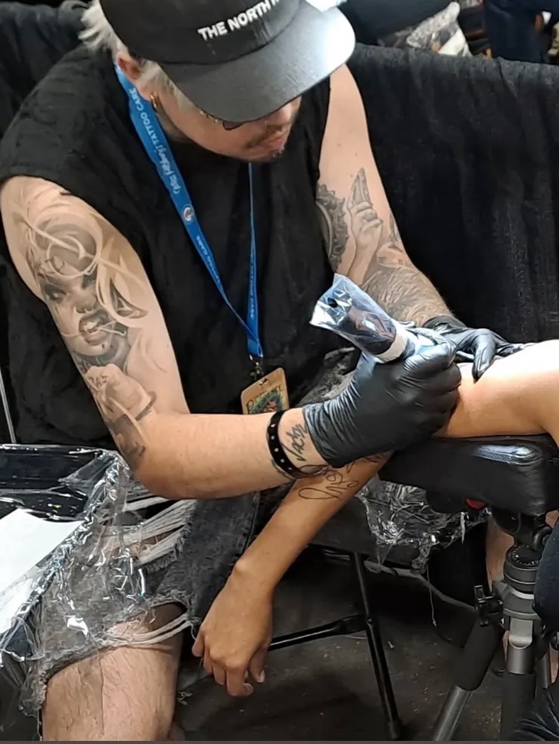 Portrait realism tattoo on the upper arm by Aiden Madrigal