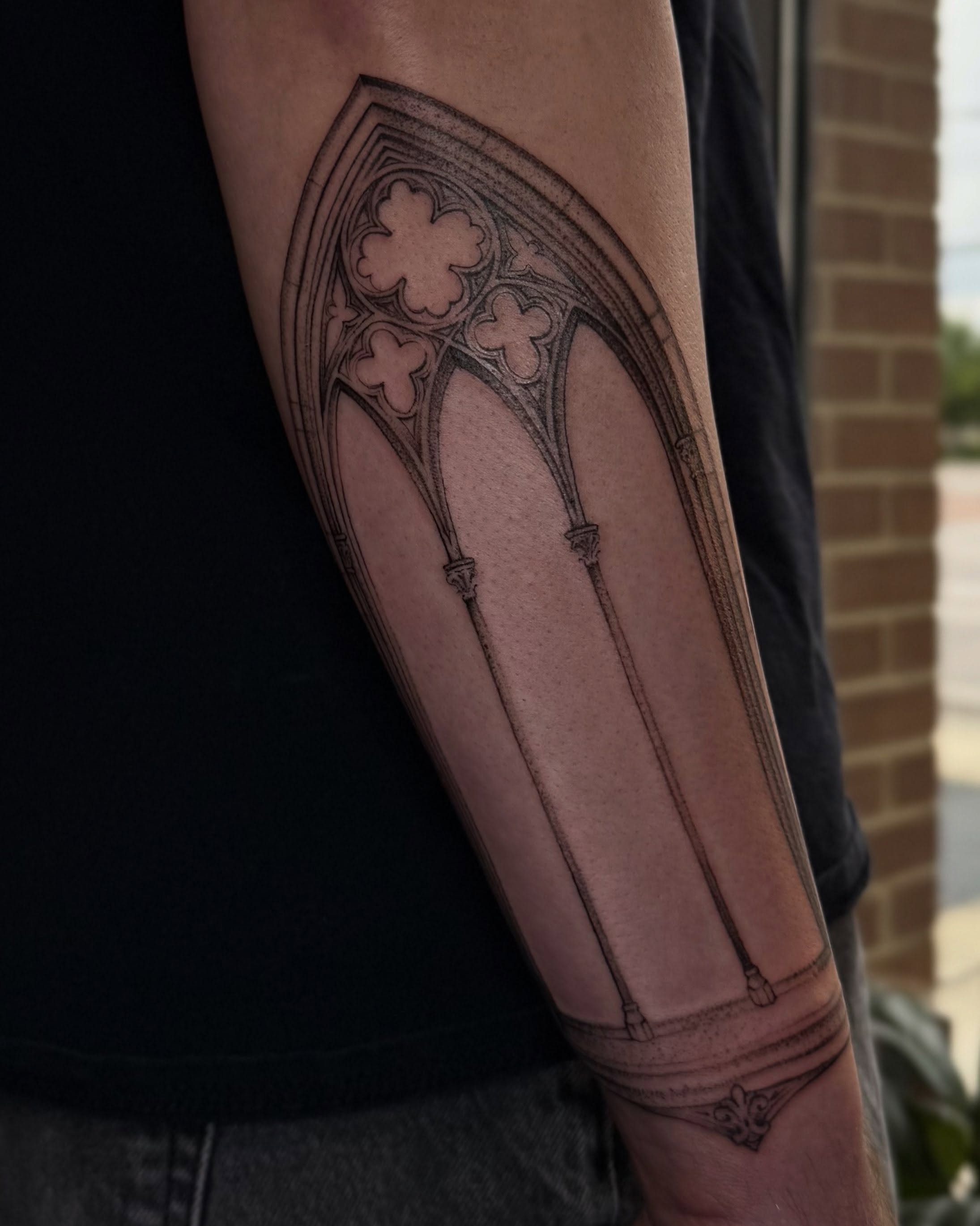 Gothic arches black and grey tattoo on the forearm by Carson Mccullers ✨