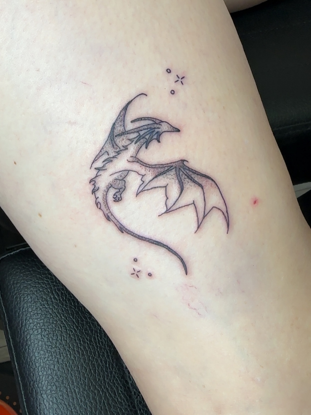 Dragon dotwork tattoo on the thigh by NuNu