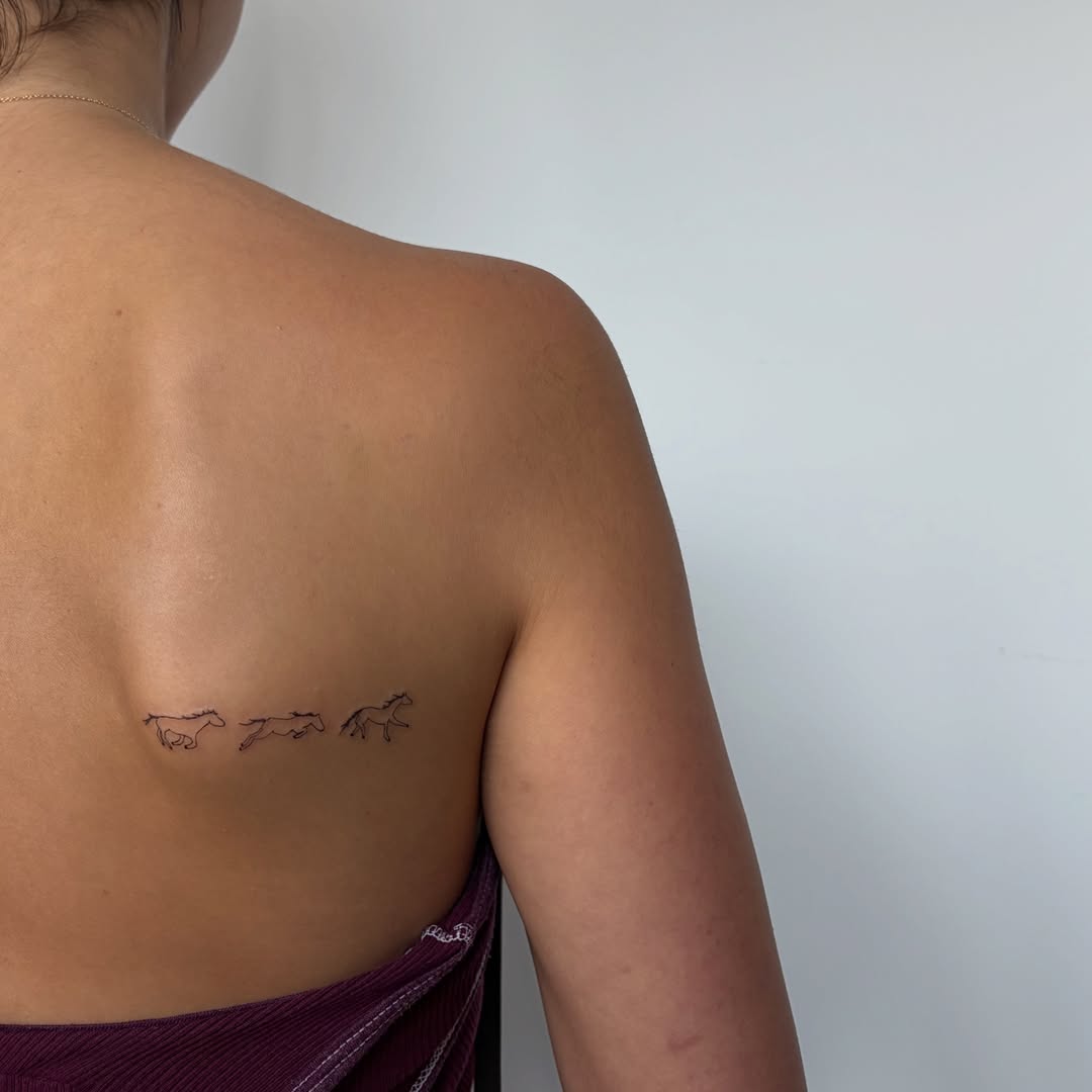 Horses minimalist tattoo on the back by annie’s tattoos ⭐꩜ .ᐟ