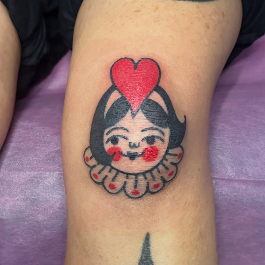 Clown face American traditional tattoo on the forearm by Kaily McKee