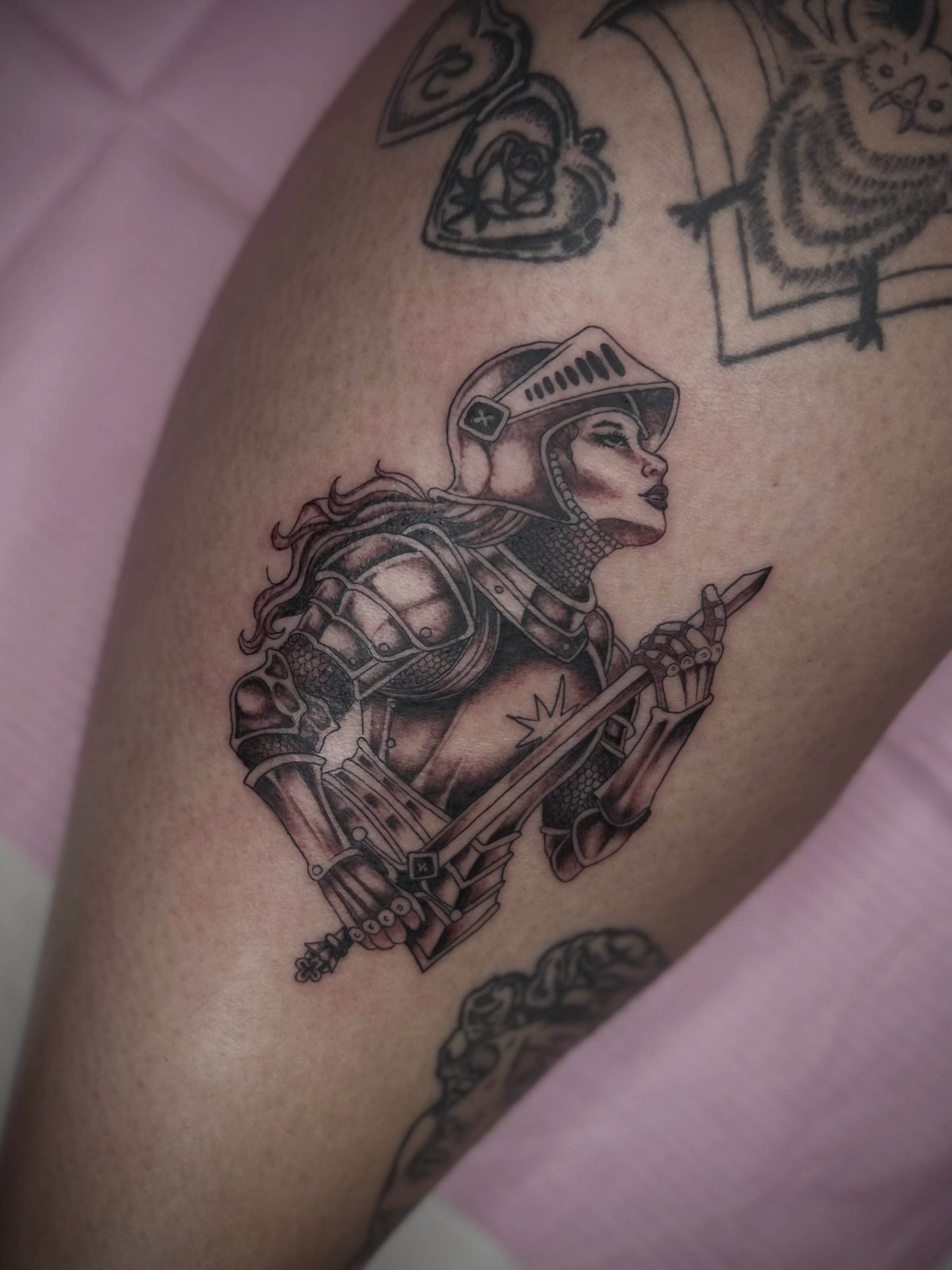 Female knight realism tattoo on the thigh by Lexi Rose