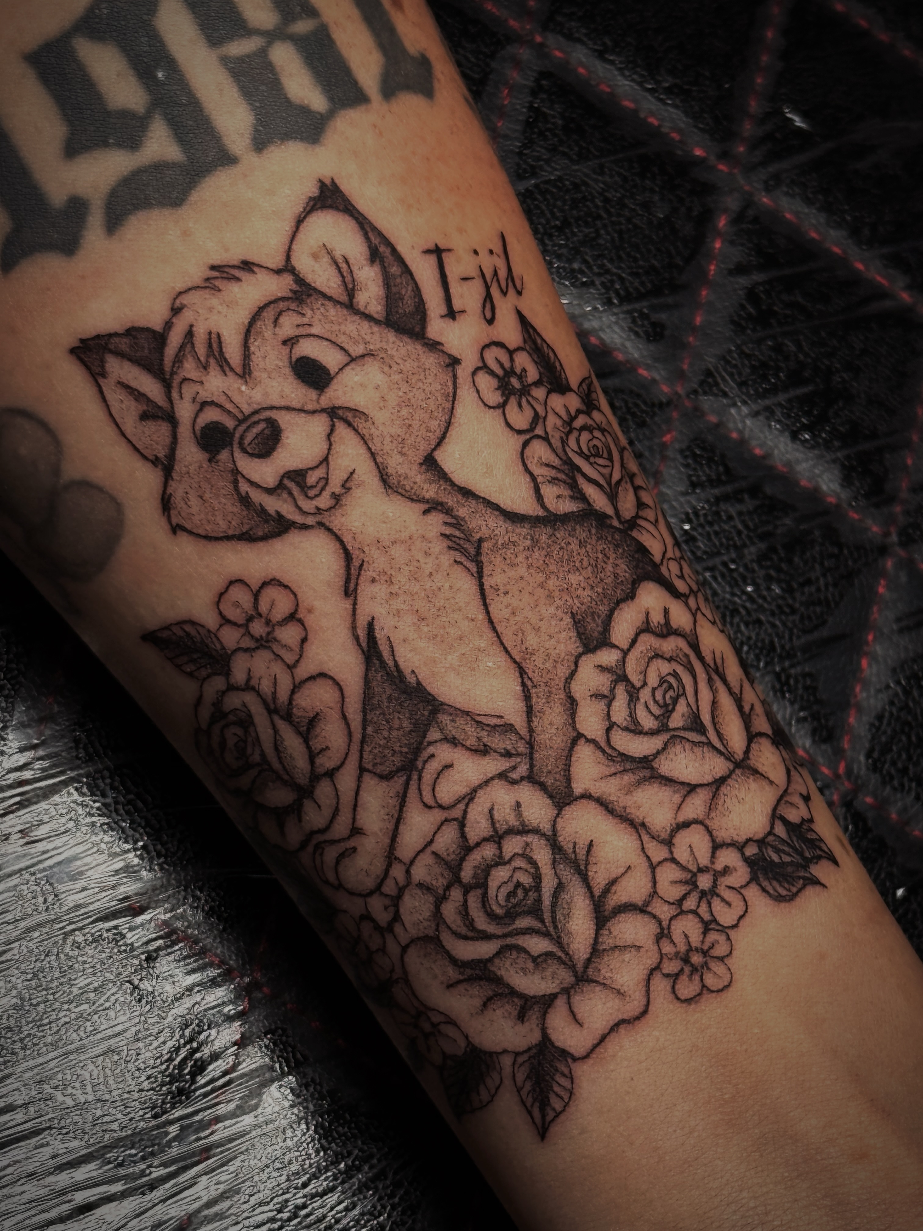 Bambi and roses black and grey tattoo on the forearm by Kaylee Castleton, Tooele, Utah