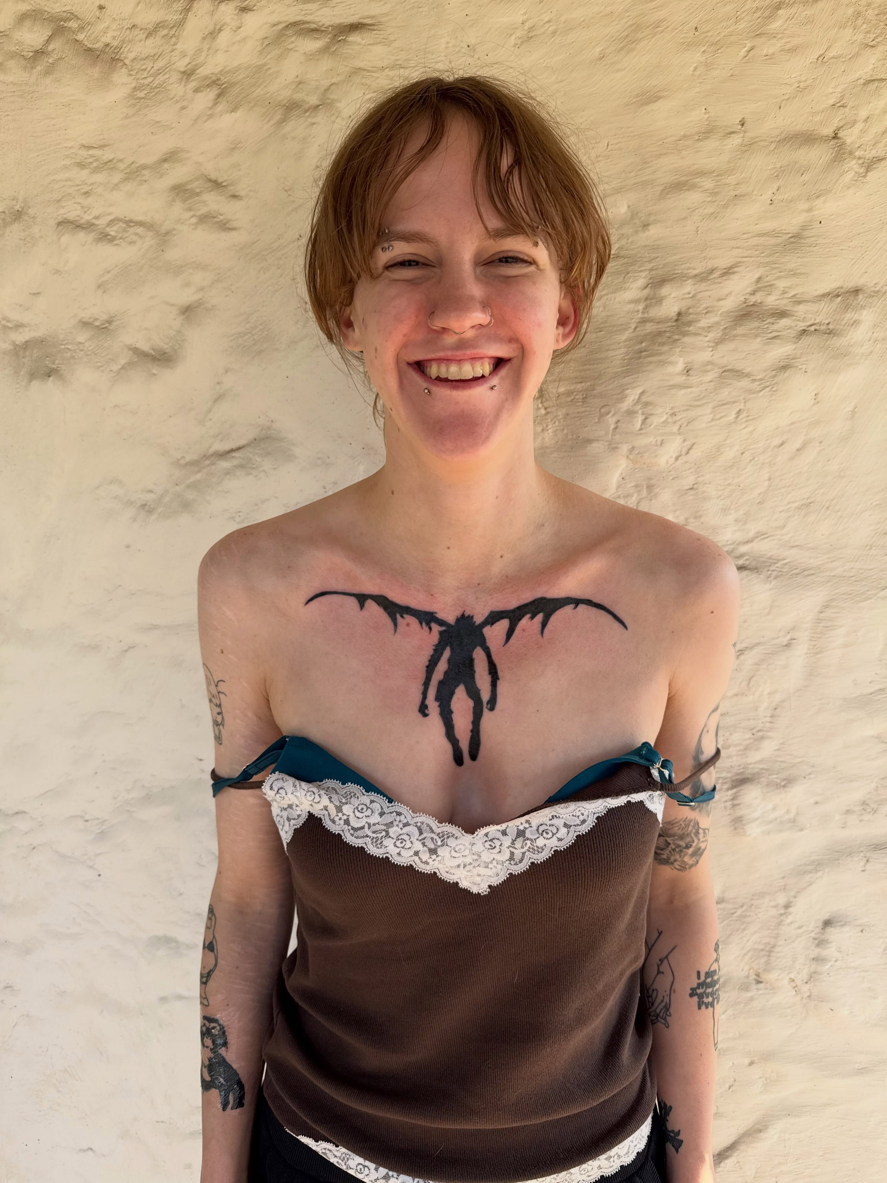 Bat black and grey tattoo on the chest by sarah