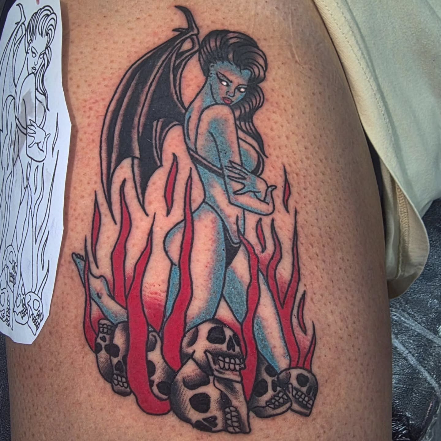 Naked woman with wings neo-traditional tattoo on the thigh by Oliver Ⴟ Graves