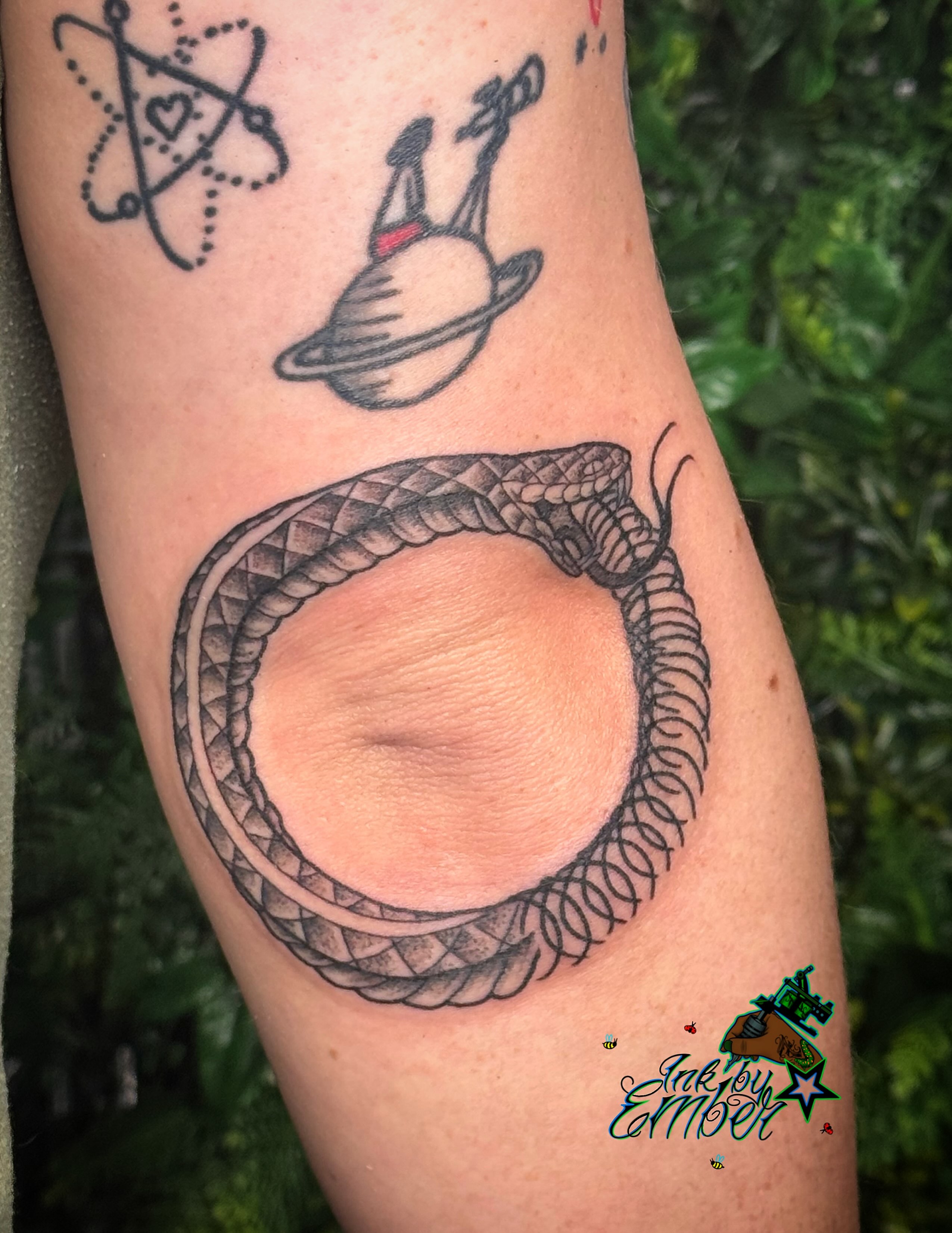 Snake American traditional tattoo on the forearm by Ember