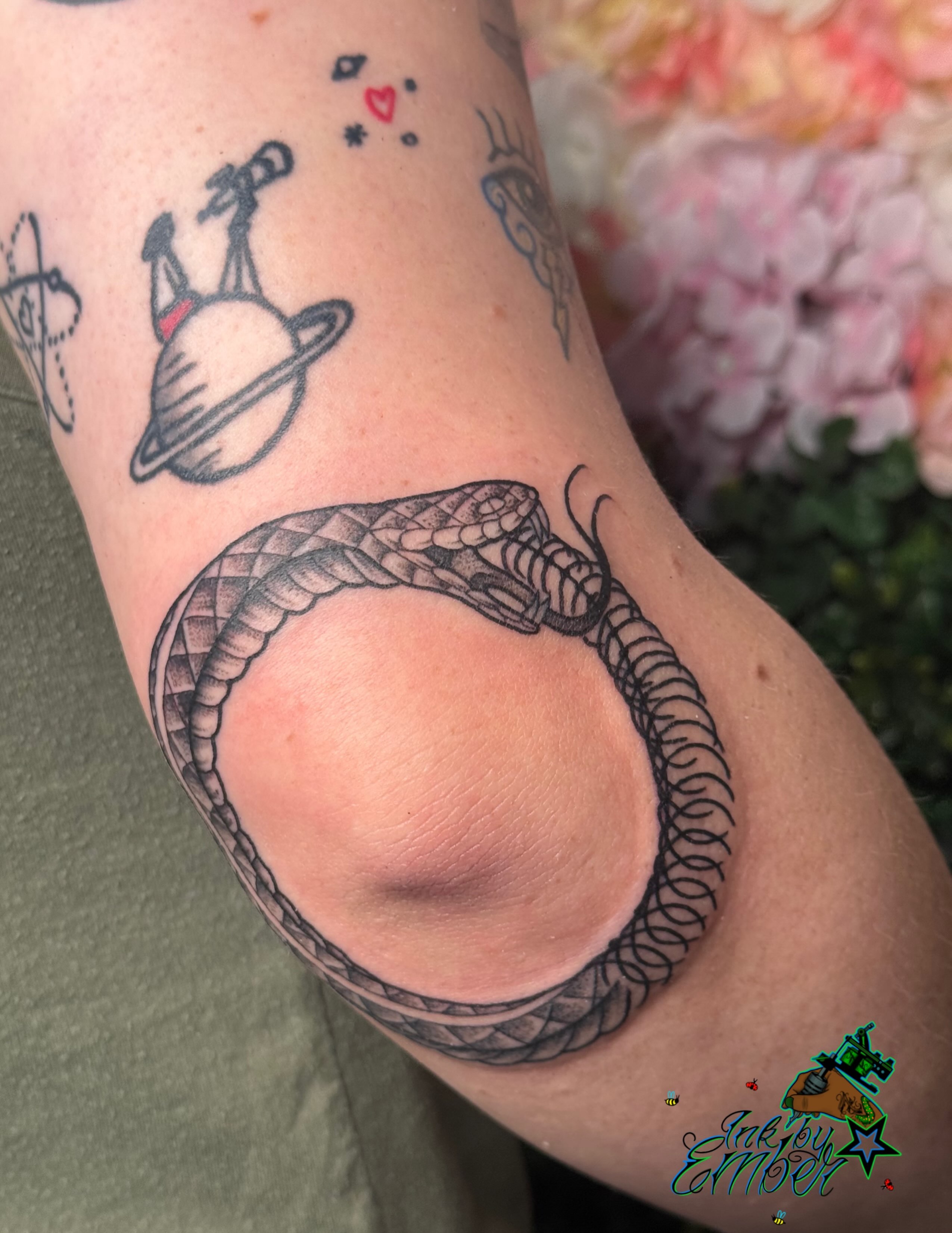 Snake black and grey tattoo on the forearm by Ember