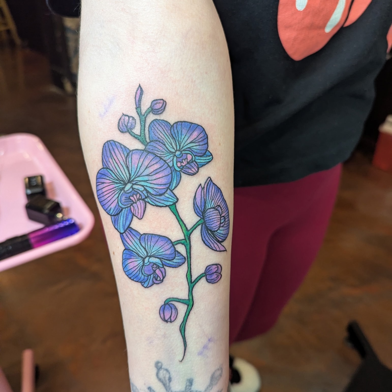 Orchid new school tattoo on the forearm by Raven FM-Tattoo Apprentice