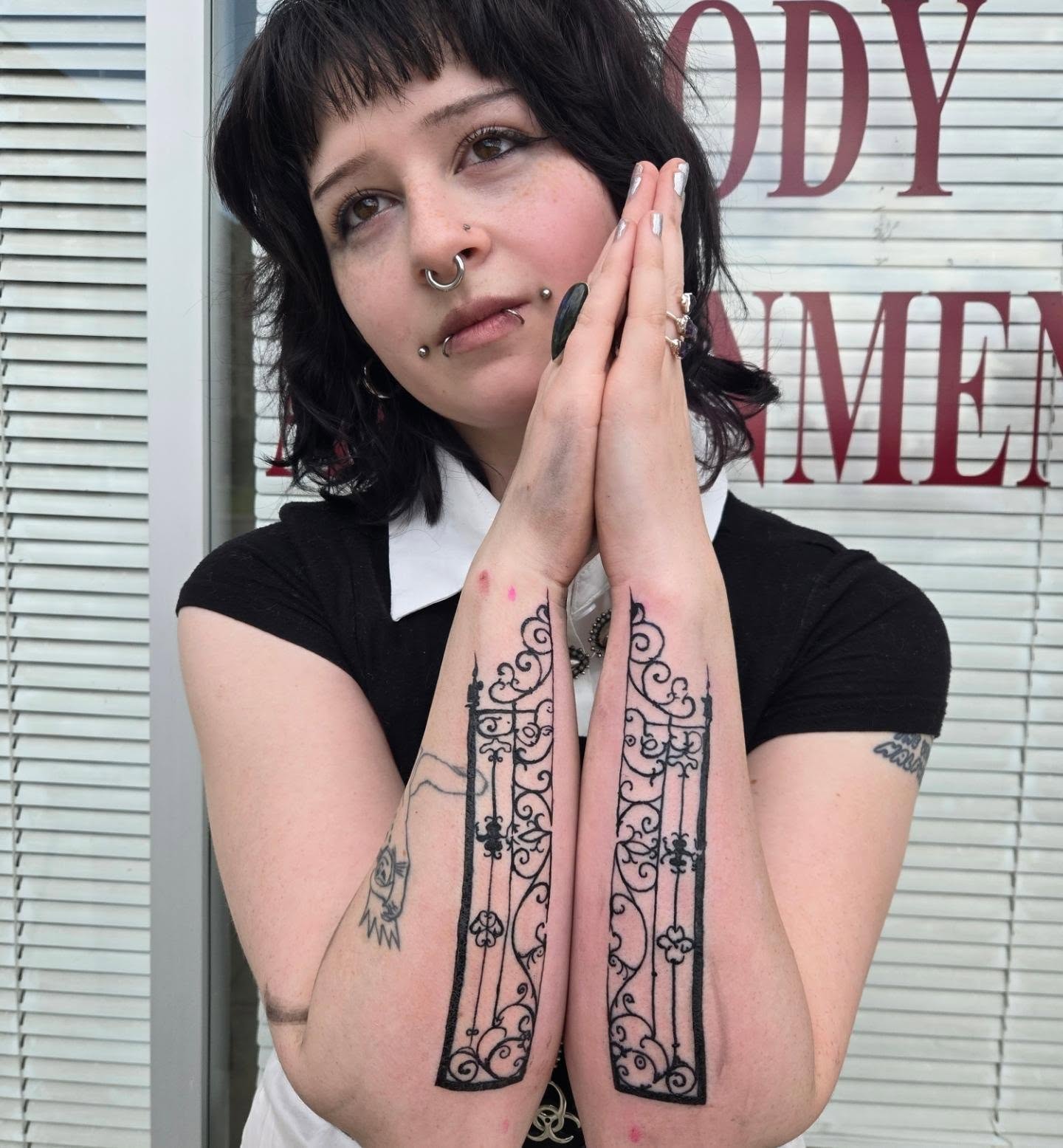 Gate ornamental tattoo on the forearm by Lane