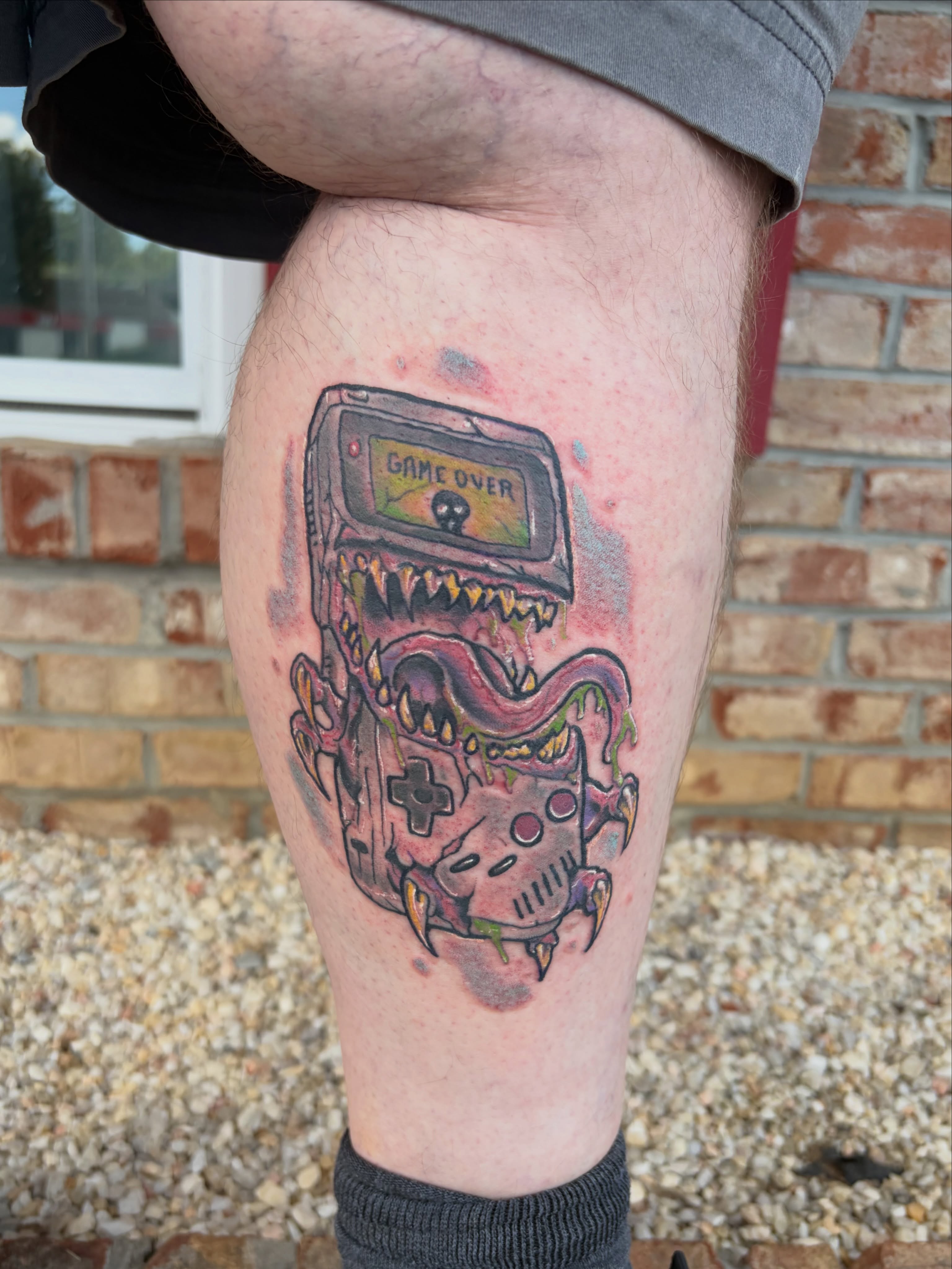 Game console dotwork tattoo on the thigh by Vudu Tattooer