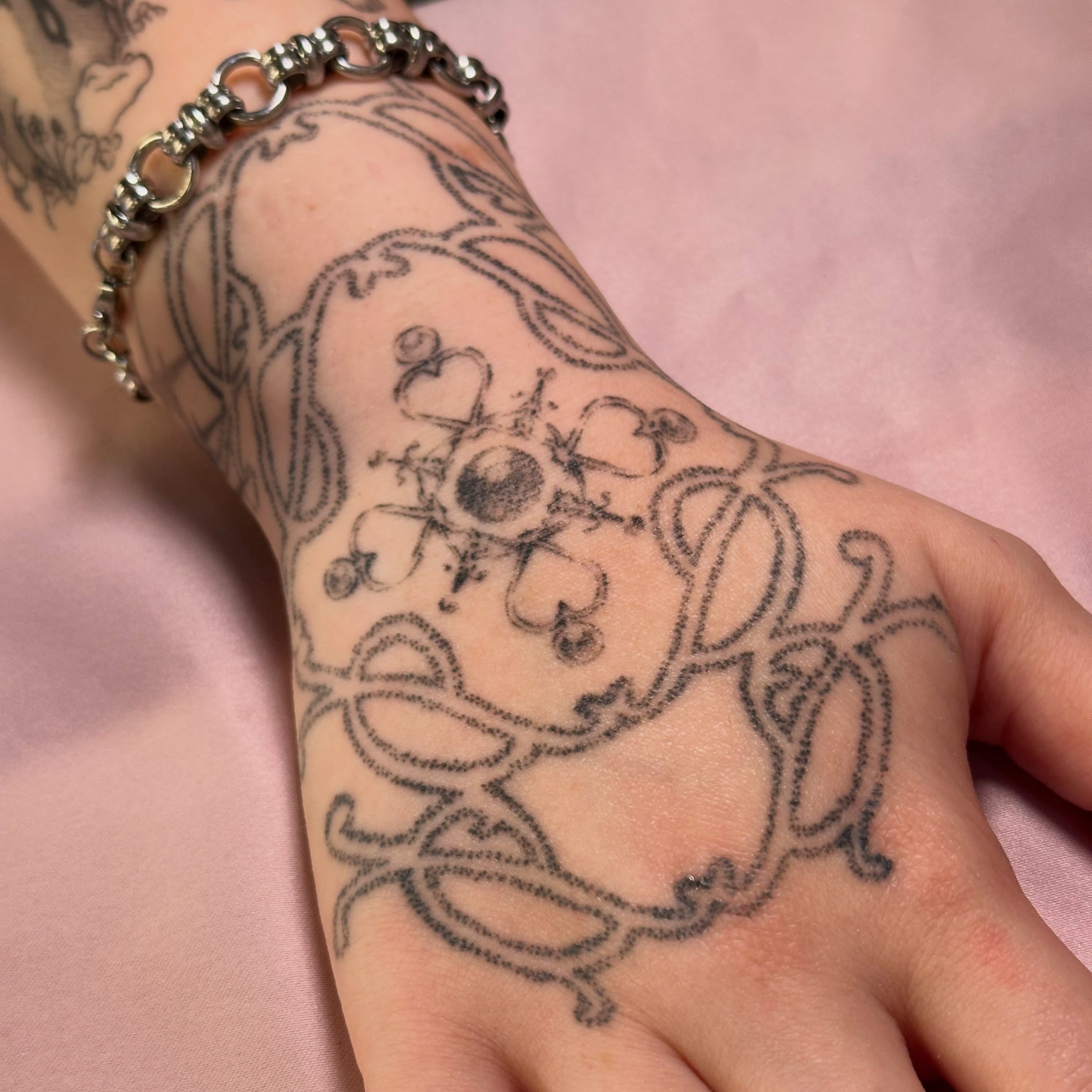 Abstract design black and grey tattoo on the hand by Jules🕯️