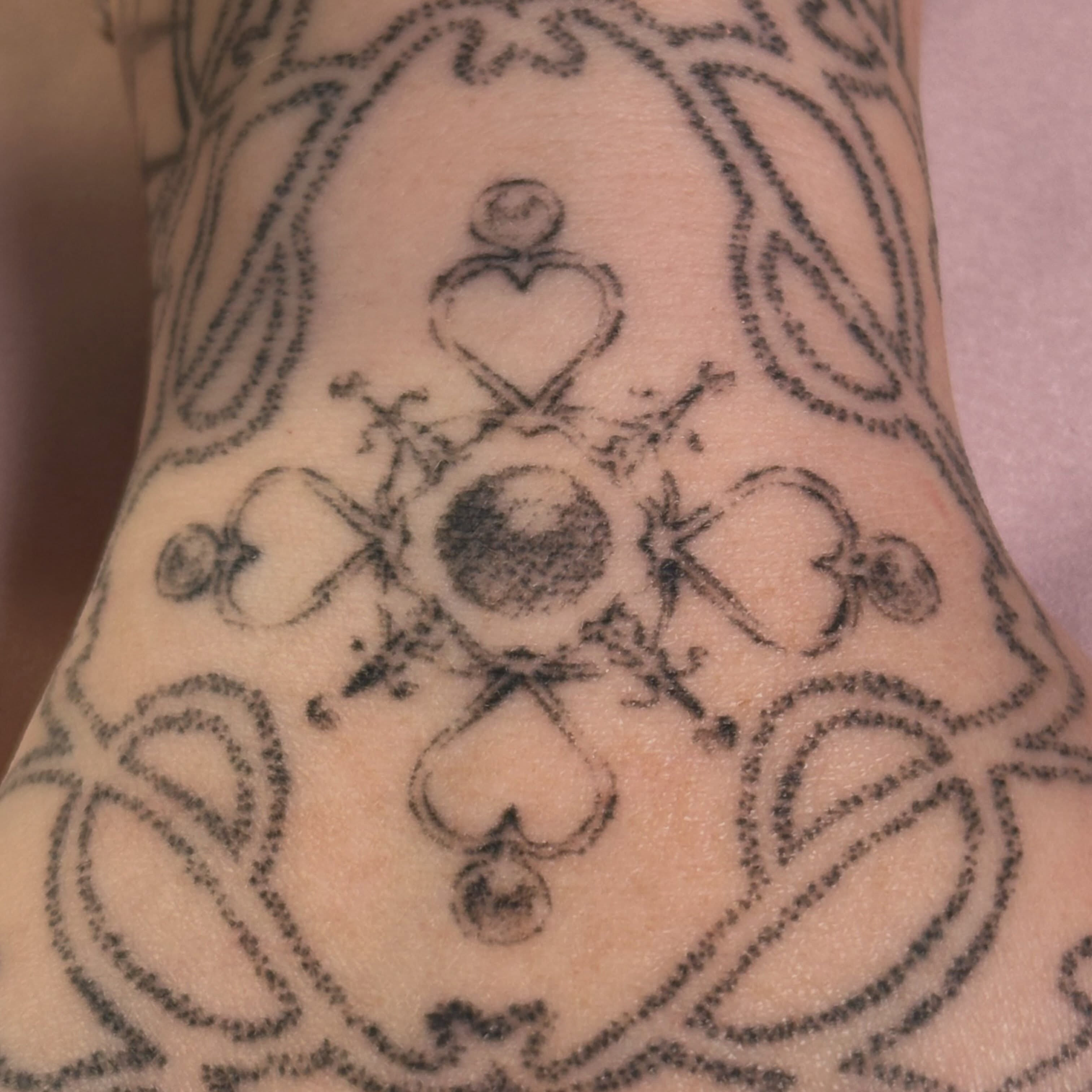 Cross and heart black and grey tattoo on the forearm by Jules🕯️