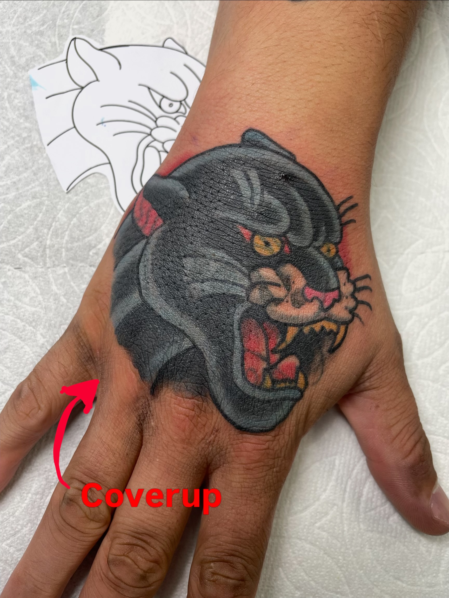 Panther realism tattoo on the hand by Steven Hodges