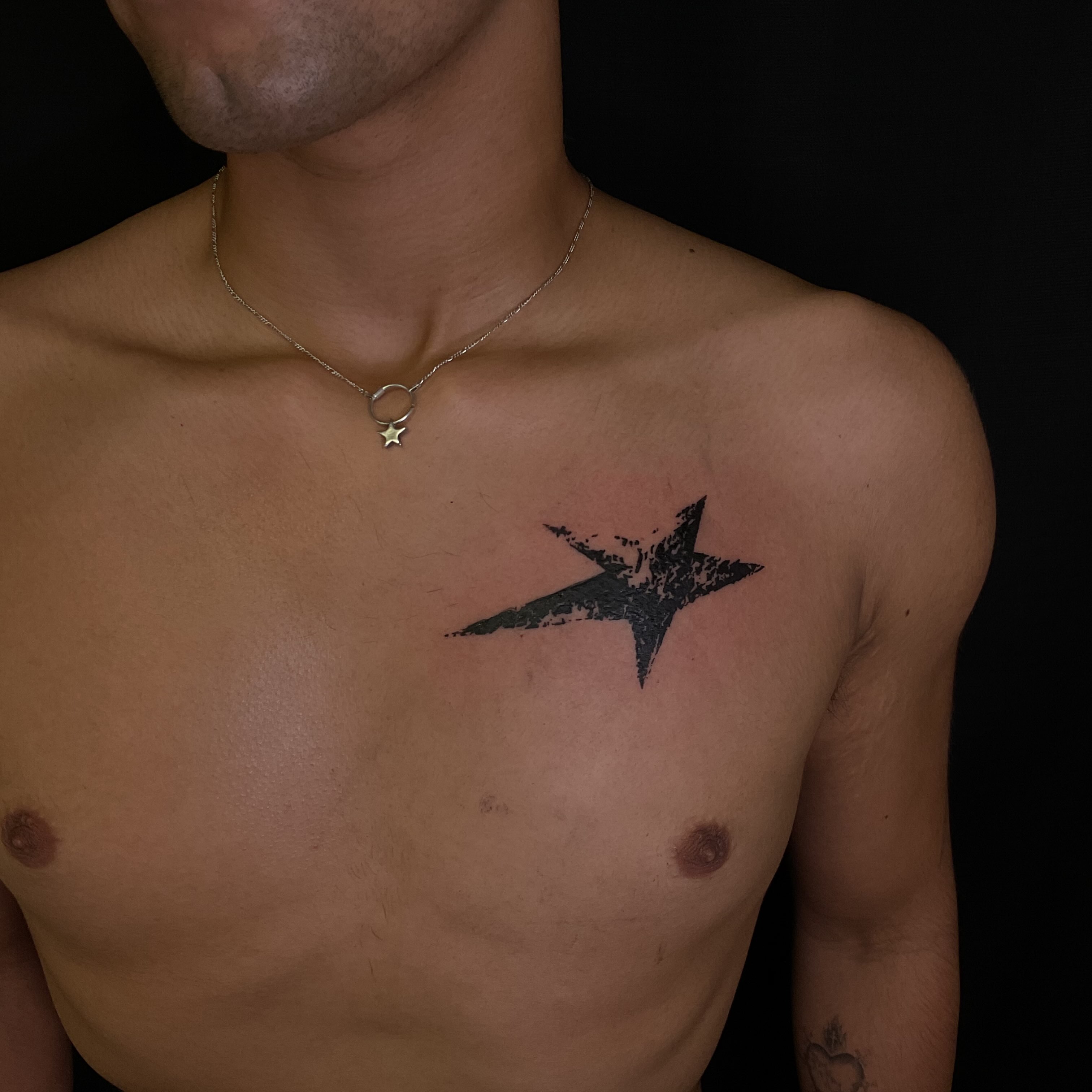 Star black and grey tattoo on the chest by Pres!