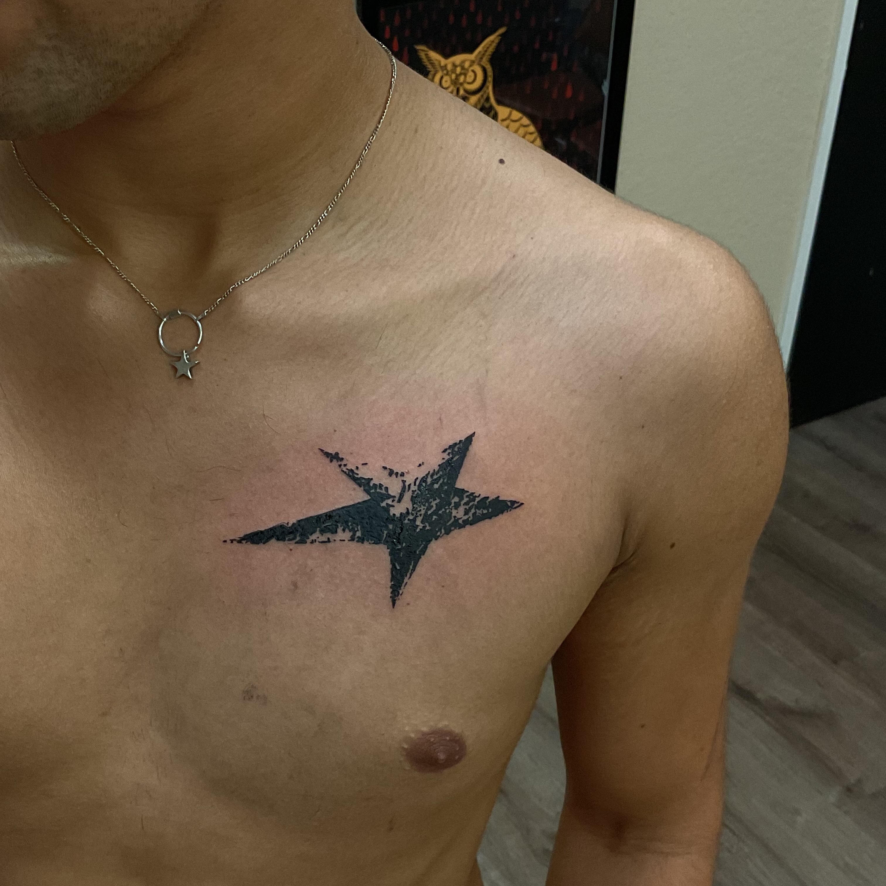 Star black and grey tattoo on the chest by Pres!