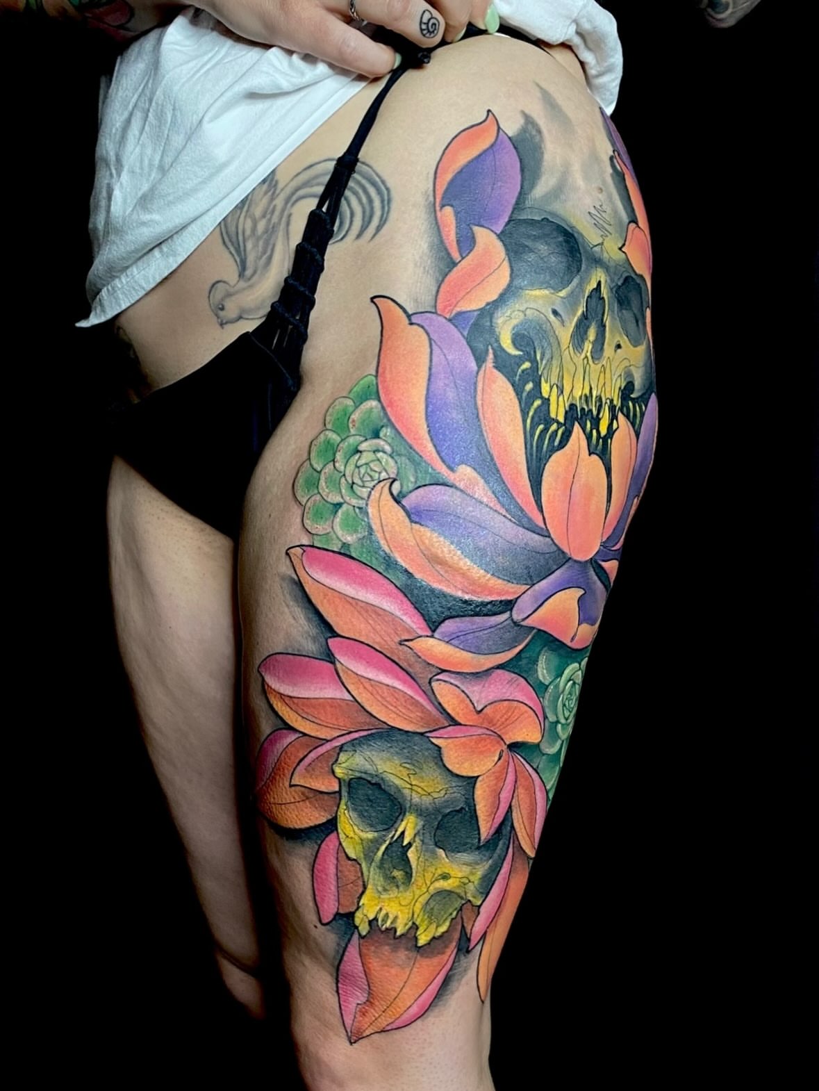 Lotus and skull new school tattoo on the thigh by jonhighland